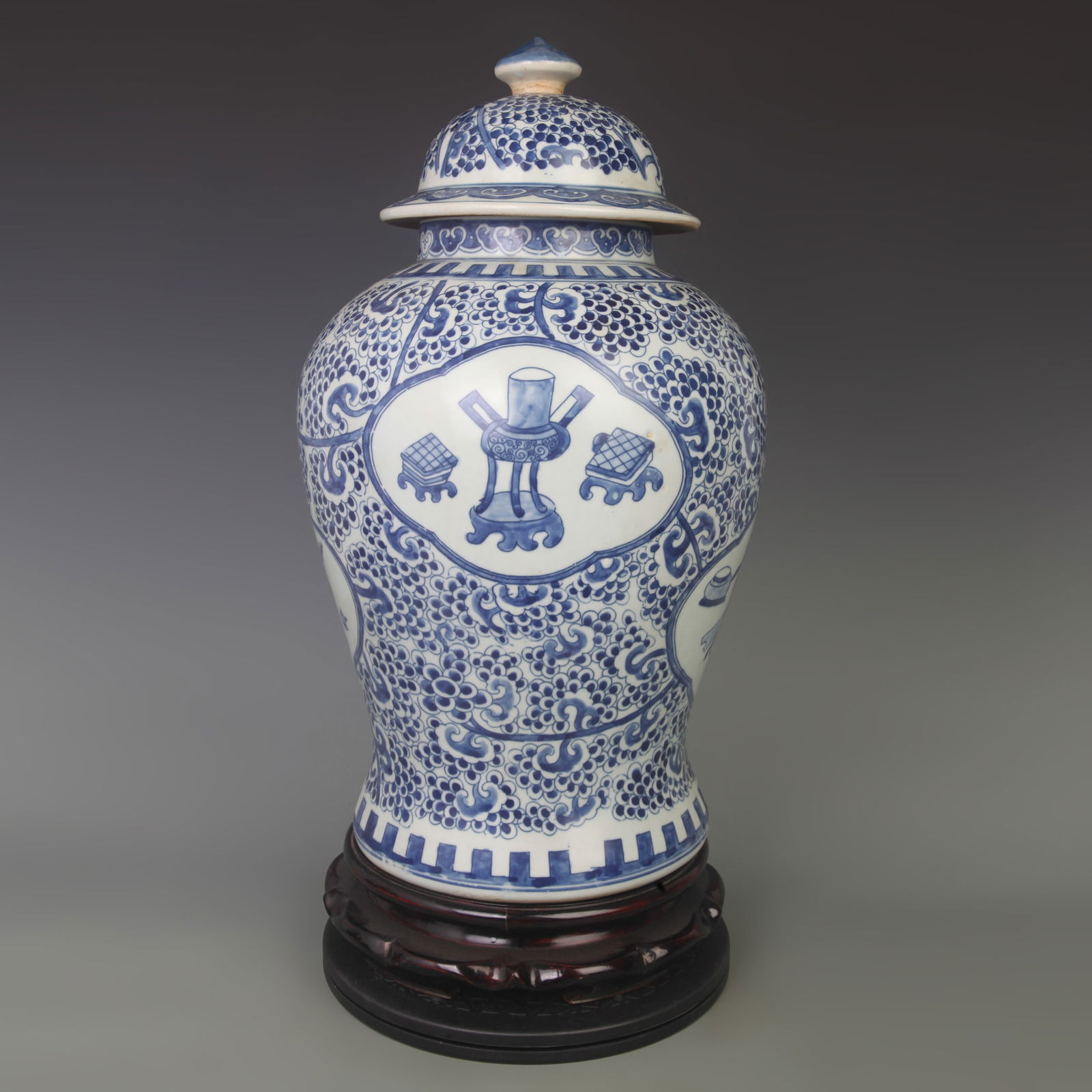 BLUE AND WHITE GLAZED OPENWORK EIGHT TREASURES GENERAL STYLE PORCELAIN JAR: Qing Dynasty; High:19.5 inch; Diameter: 5.6 inch