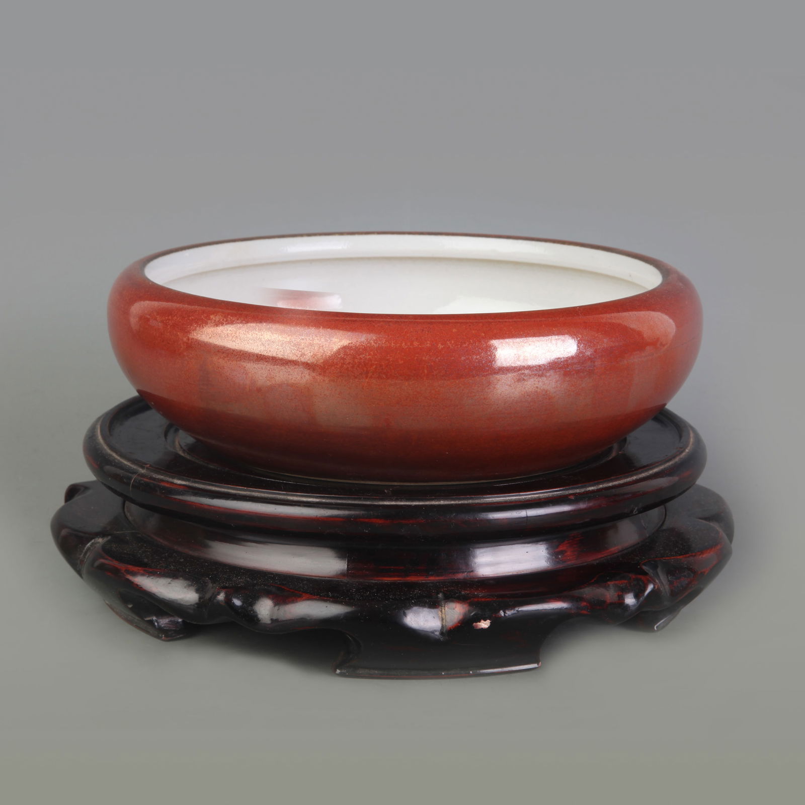 A FINE DARK RED GLAZED PORCELAIN BRUSH WASHER: Qing Dynasty Wang Bing Rong Mark; Diameter: 7.2 inch; High: 2.4 inch