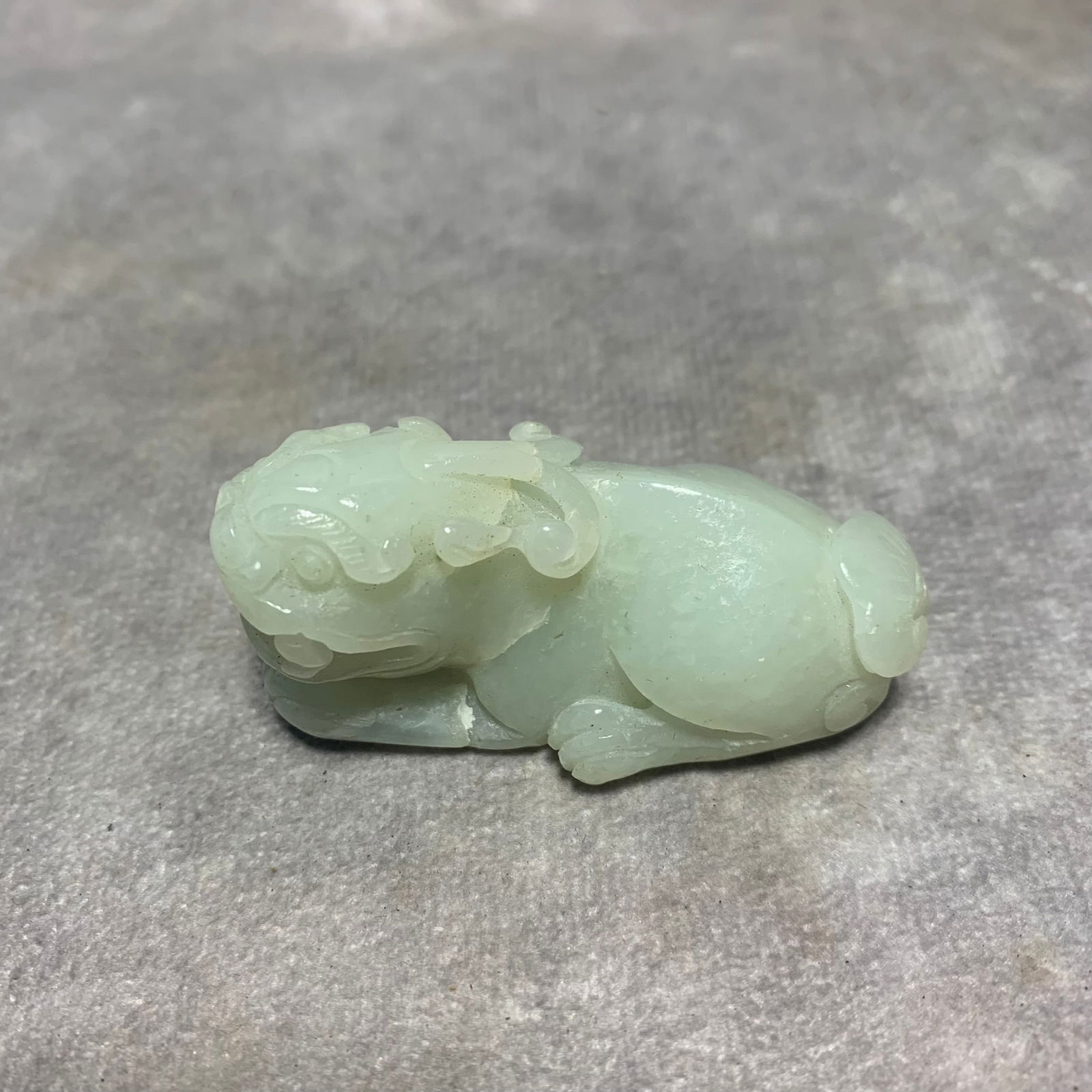HETIAN GREENISH-WHITE JADE PENDANT OF MYTHICAL LION: Qing Dynasty; Long: 2 inch; Width: 1.1 inch; High: 0.9 inch;