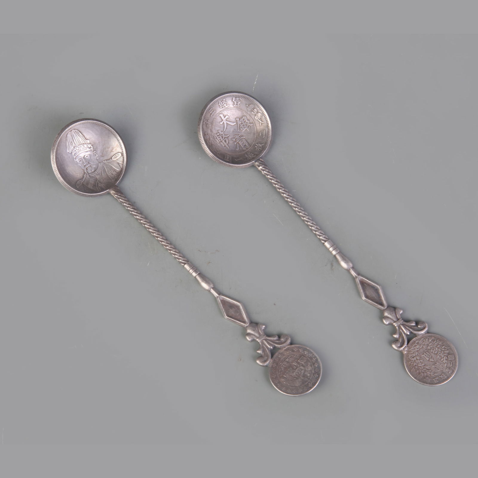 A PAIR OF CHINESE COIN MADE SPOONS (1 of 9)