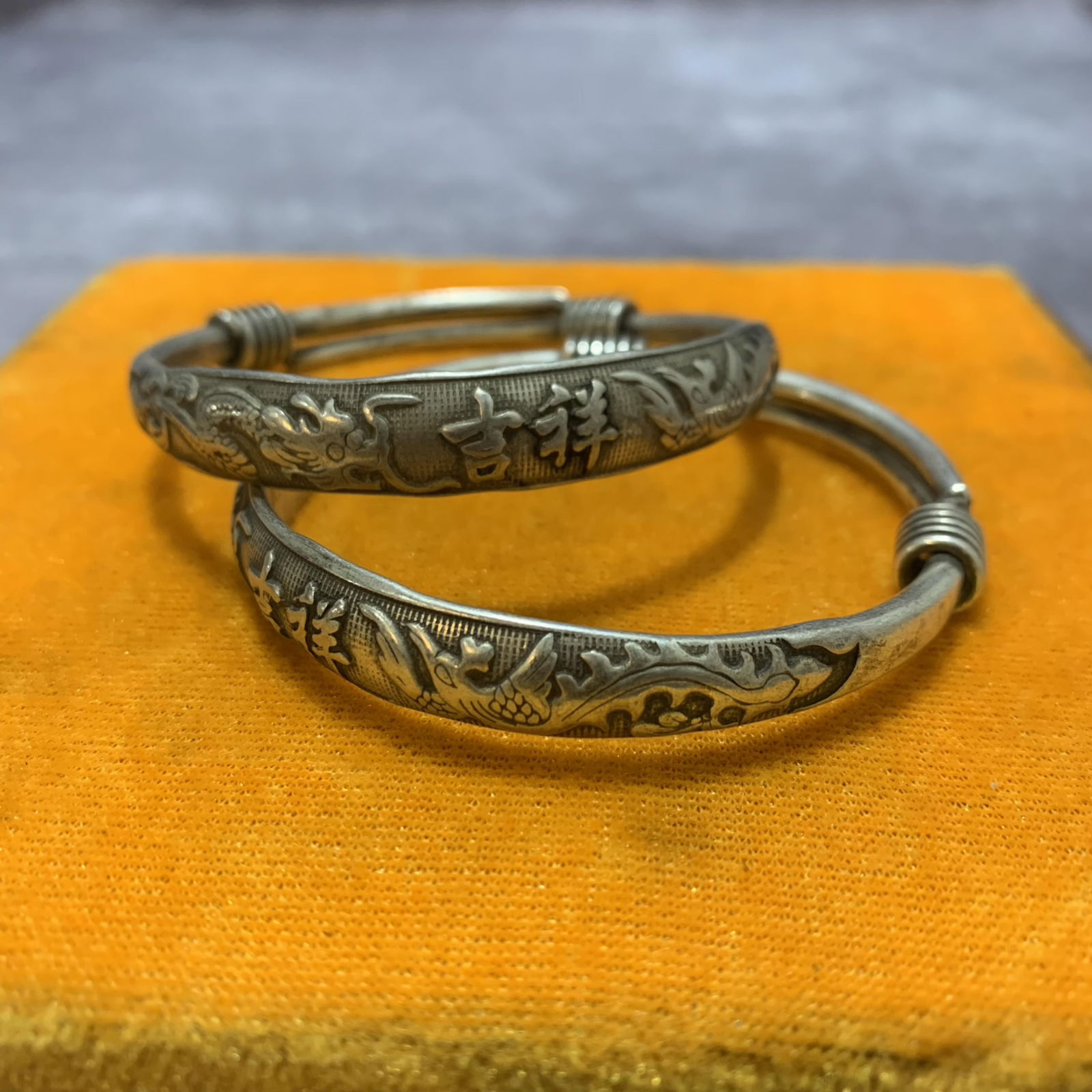 PAIR OF WHITE BRONZE BRACELETS: Modern; Diameter: 2.6 inch;