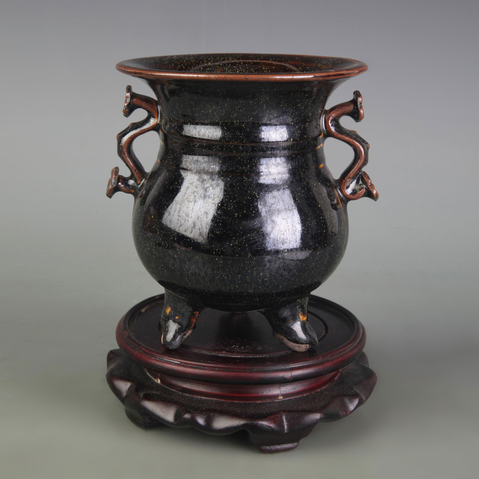 A FINE BLACK GLAZED RUYI EAR TRIPOD PORCELAIN CENSER: Qing Dynasty; Diameter: 4.4 inch ; High: 5.0 inch