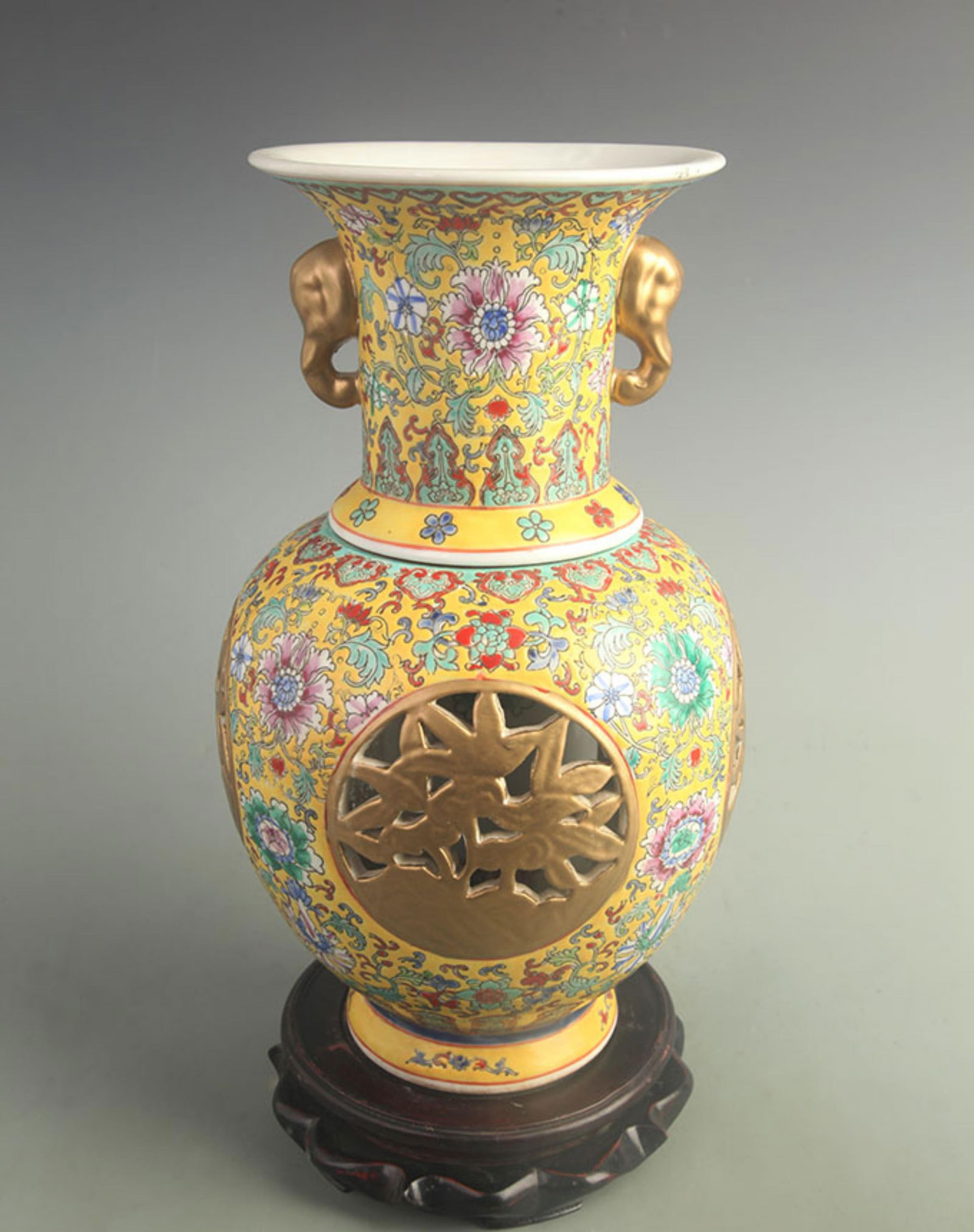 YELLOW GROUND FOUR-FACED CARVED INNER TURNING PORCELAIN VASE: Qing Dynasty Qianlong Period; High: 13.5 inch; Width: 6.50 inch;