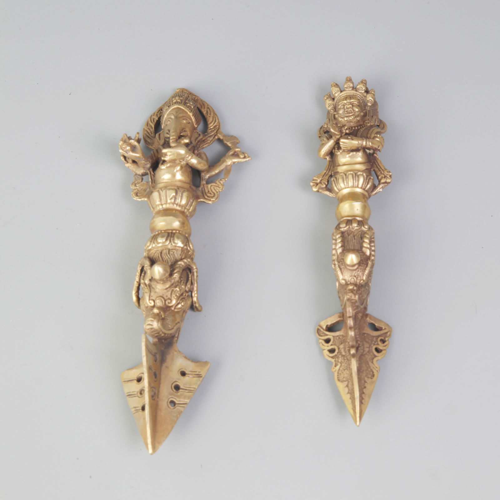 TWO TIBETAN GILT-BRONZE RITUAL IMPLEMENTS: Qing Dynasty