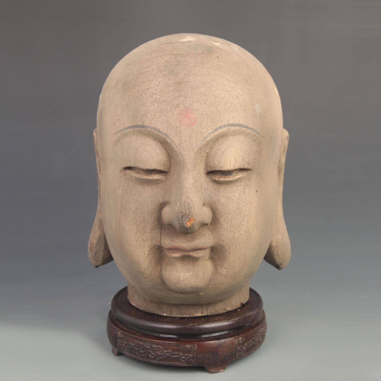 A WOODEN CARVED STATUE OF BODHISATTVA HEAD: 18th Century; High: 10.75 inch; Width: 8.50 inch;