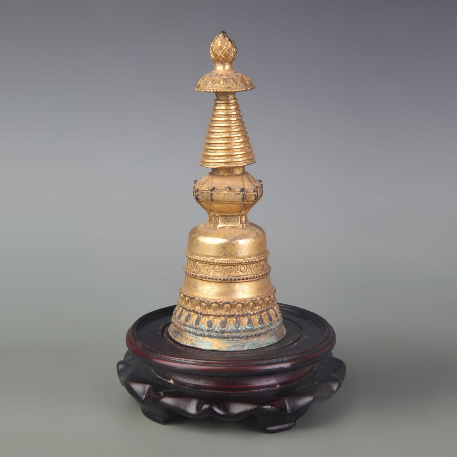 A FINE BRONZE GILDED BRONZE RELIC PAGODA: Qing Dynasty; Diameter: 2.6 inch; High: 6.6 inch;