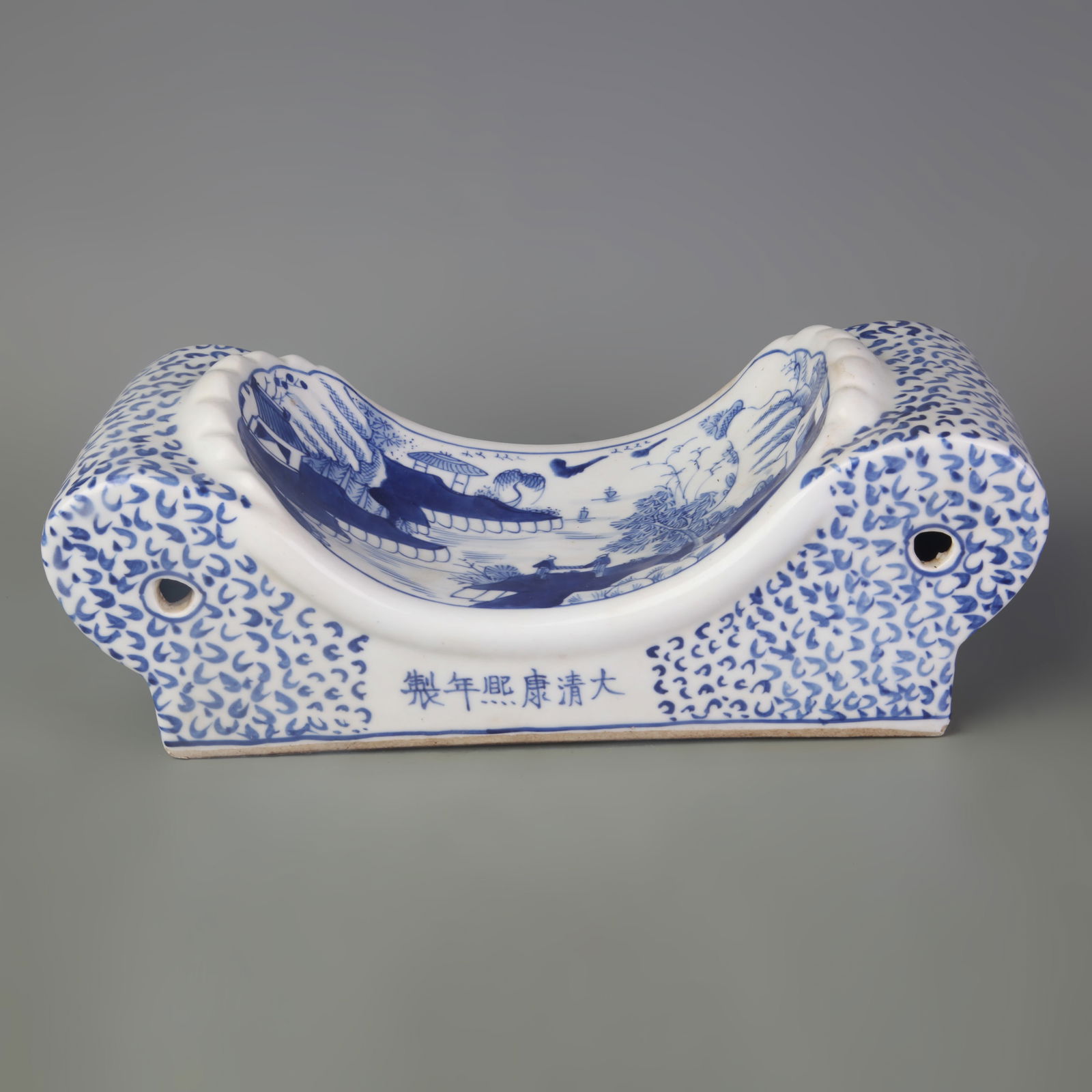 BLUE AND WHITE PORCELAIN PILLOW WITH LANDSCAPE DESIGN: Qing Dynasty Kang Xi Period; Long: 11.1 inch; High:4.1 inch