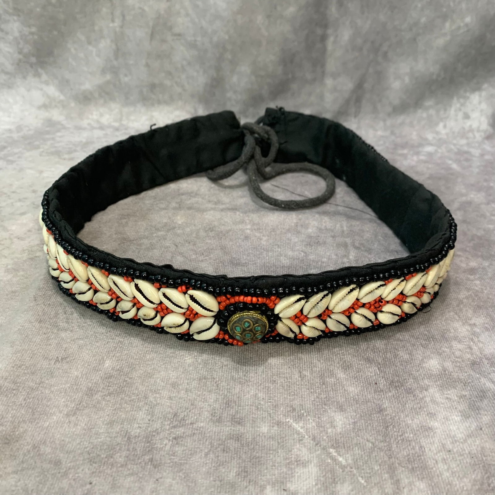 A FINE TIBETAN CORAL AND SHELL MADE BELT: Modern; Long: 26 inch;