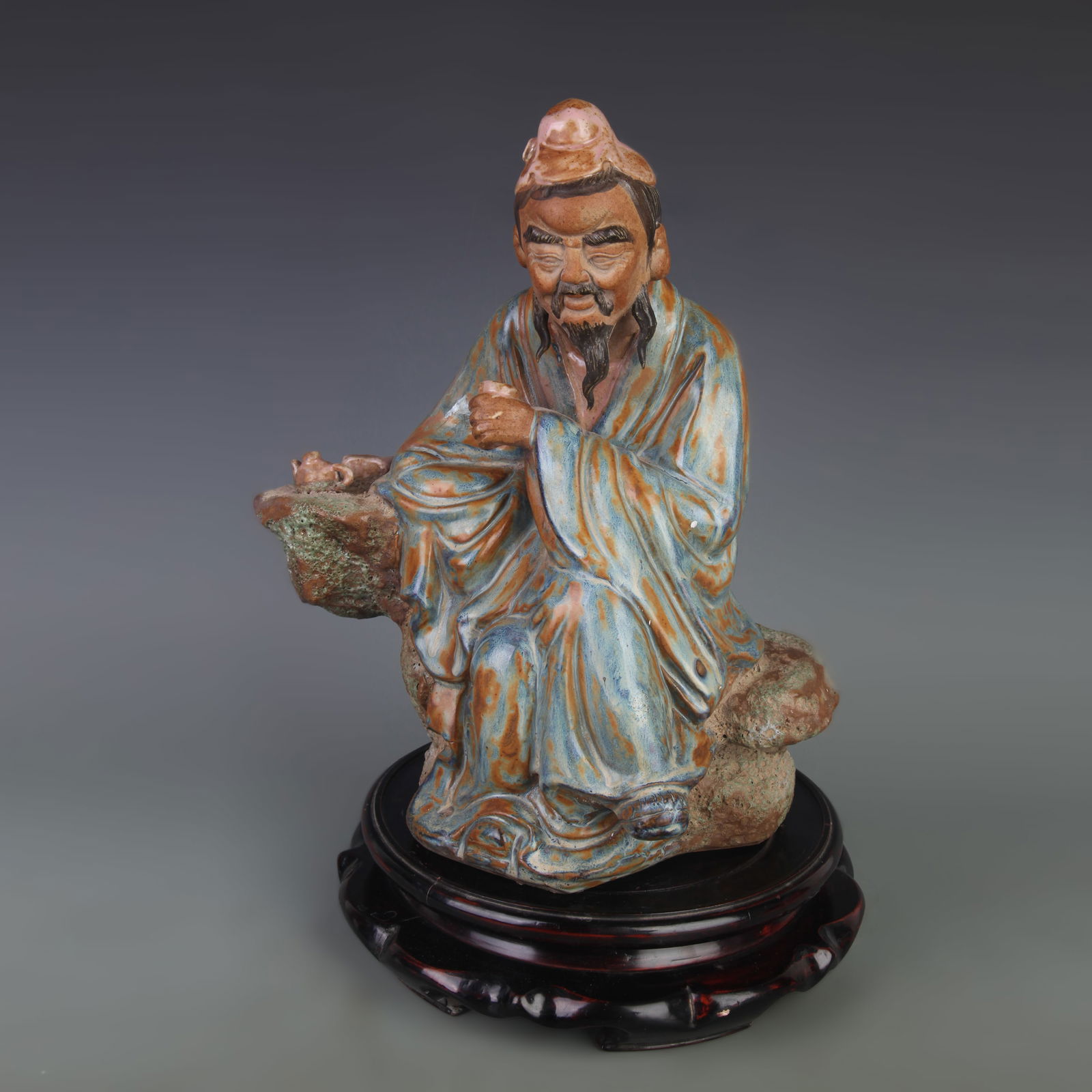 A FINE CERAMIC SCULPTURE OF LU YU: Qing Dynasty; Long: 10.7 inch; Width: 6.6 inch; High:12.9 inch
