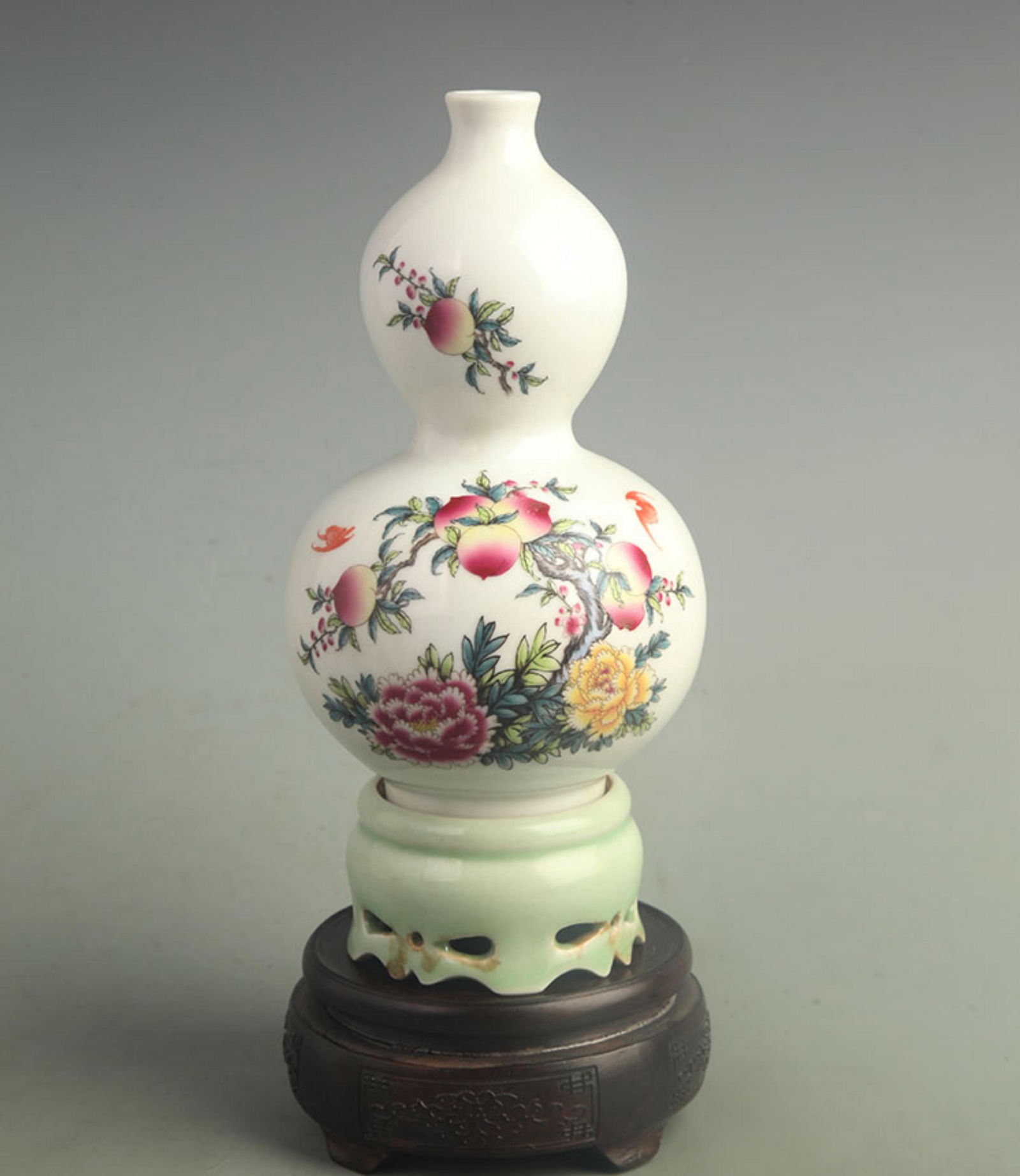 FAMILLE ROSE PORCELAIN VASE WITH AUSPICIOUS SYMBOLS OF WEALTH: Qing Dynasty; High: 9.50 inch; Width: 4.20 inch;
