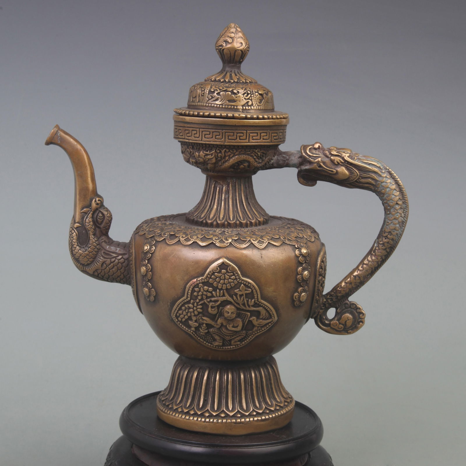 A FINE CHARACTER CARVING DRAGON HANDLE BRONZE EWER: Qing Dynasty; High: 9.5 inch; Width: 8.5 inch;