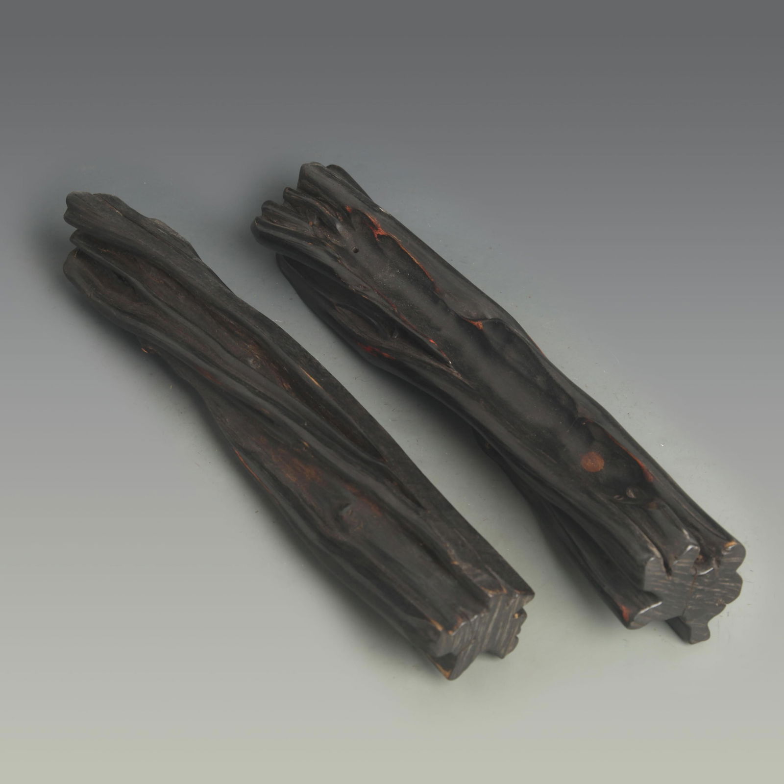 BLACK SANDALWOOD-SHAPED PAPERWEIGHT: 20th Century; Long: 11.0 inch; Width: 2.25 inch;