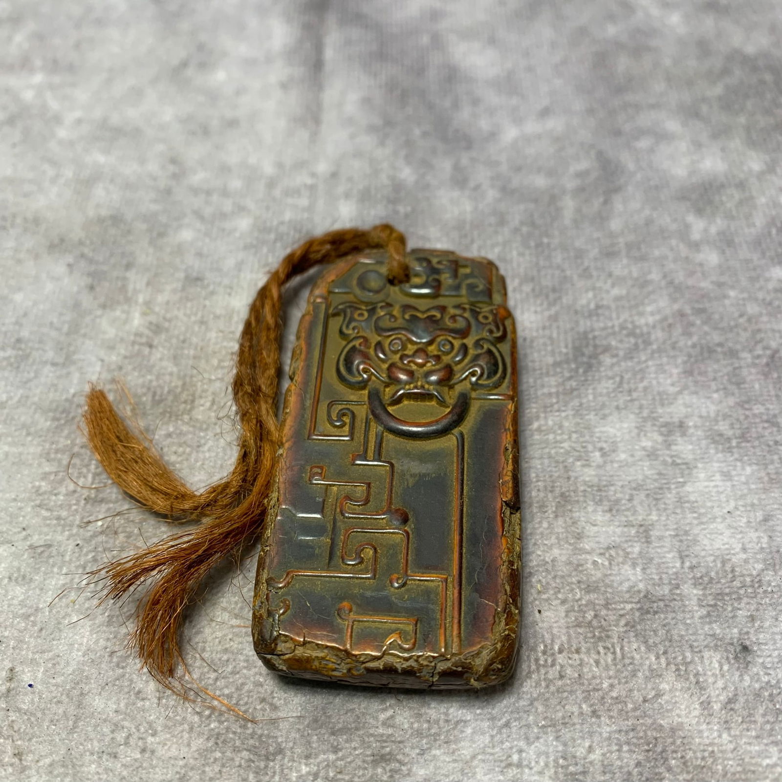 A FINE BONE PENDANT WITH BEAST-MASK MOTIF: Ming Dynasty; Long: 1.3 inch; Width: 0.4 inch; High: 2.6 inch;