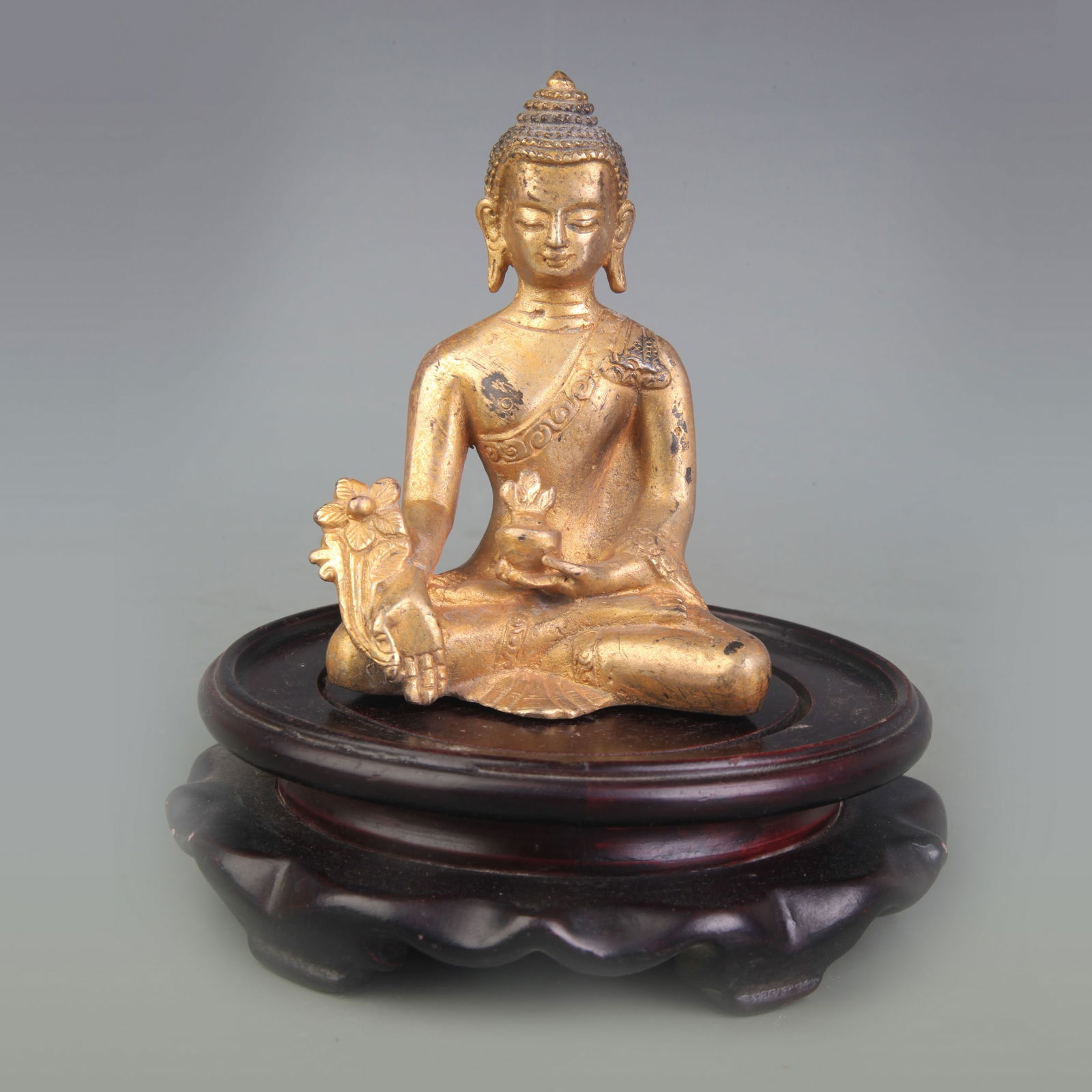 A SMALL BRONZE BHAISAJYAGURU (MEDICINE BUDDHA) STATUE: Qing Dynasty; High: 4.0 inch