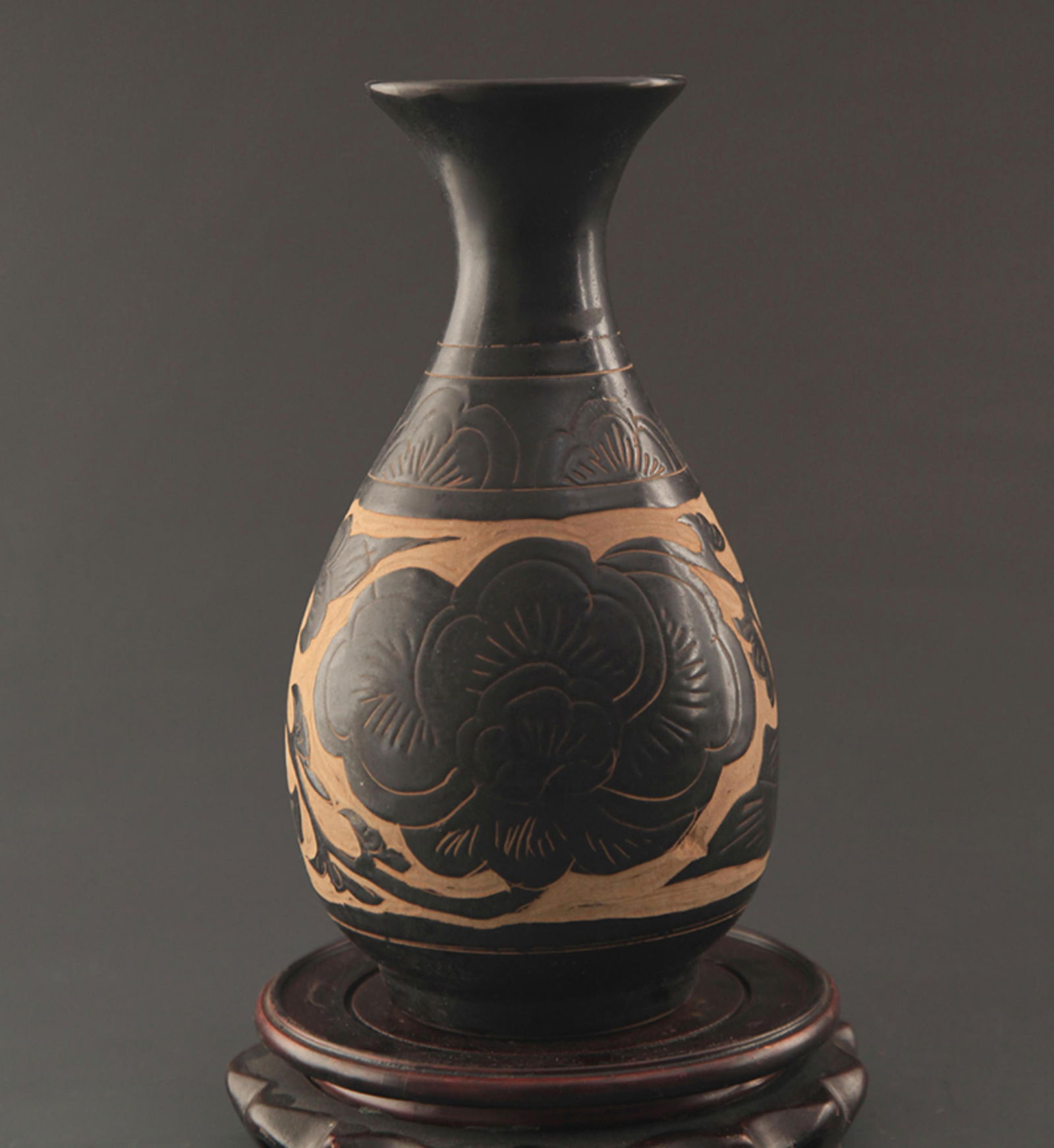 CIZHOU KILN BLACK GLAZED CARVED PEONY PATTERN YU HU CHUN BOTTLE: Song Dynasty Style; High: 10.25 inch; Diameter: 3.5 inch;