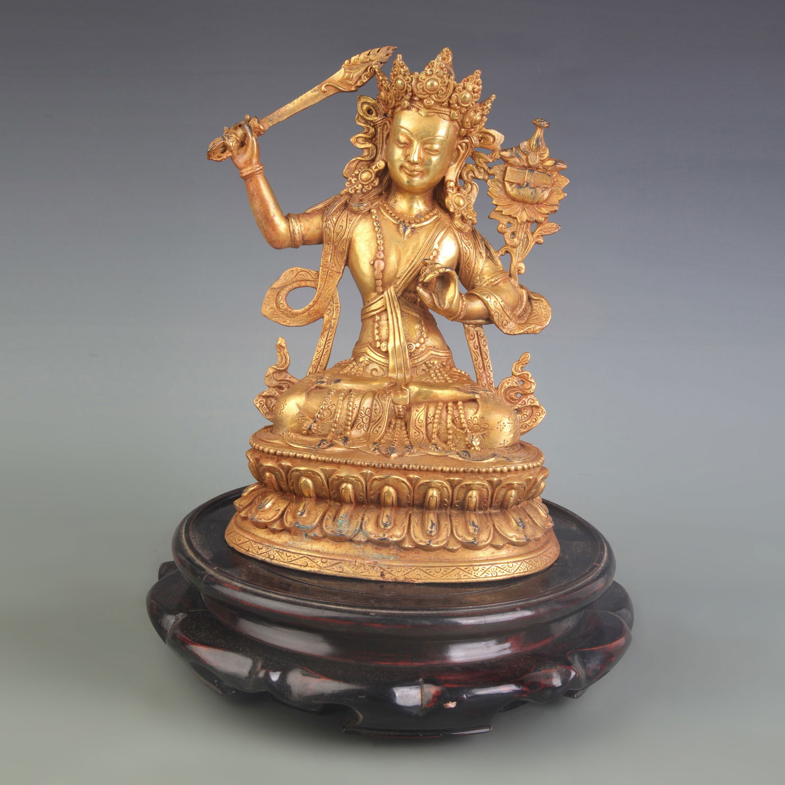 A FINE BRONZE MANJUSHRI BODHISATTVA STATUE: Qing Dynasty; Width: 7.5 inch; High: 10.0 inch;
