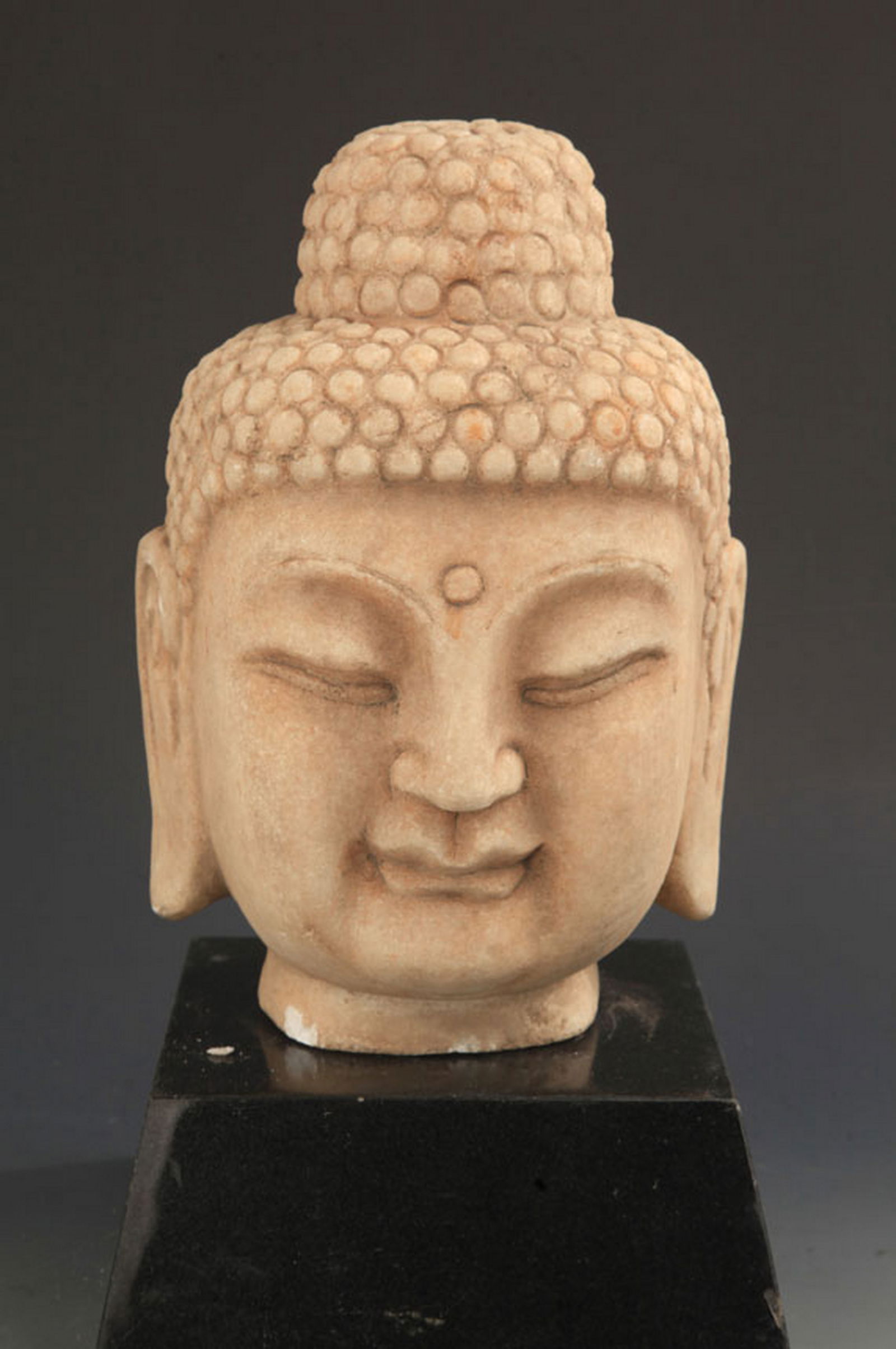 A LARGE STONE CARVED BUDDHA HEAD: Northern and Southern dynasties Style; High: 10.25 inch; Width: 7.0 inch