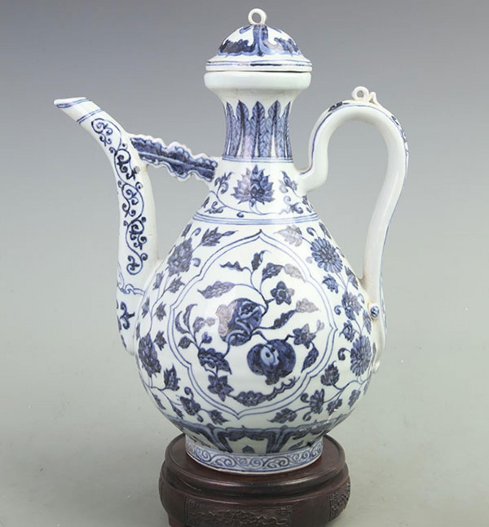 BLUE AND WHITE TWINING LOTUS PATTERN PORCELAIN EWER: Yuan Dynasty Style; High: 13.0 inch; Width: 10.0 inch;