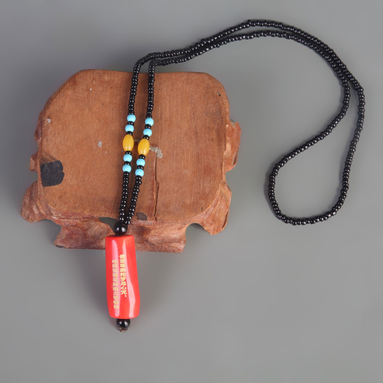 A FINE RED CORAL MADE NECKLACE: Modern; Long: 1.4 inch; Width: 0.5 inch