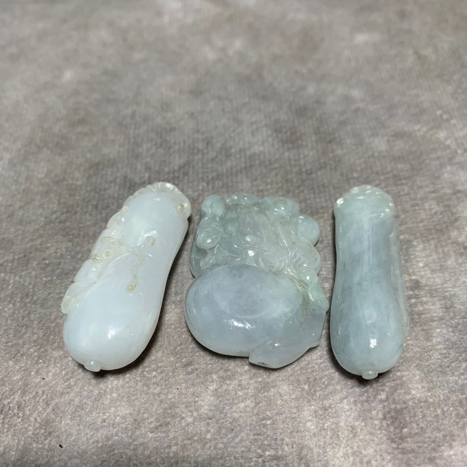 GROUP OF HETIAN JADE PENDANTS (THREE PIECES): Modern; Long: 1.5; 1.5; 1.4 inch; Width: 1; 0.6; 0.5 inch; High; 0.3; 0.4; 0.3 inch;