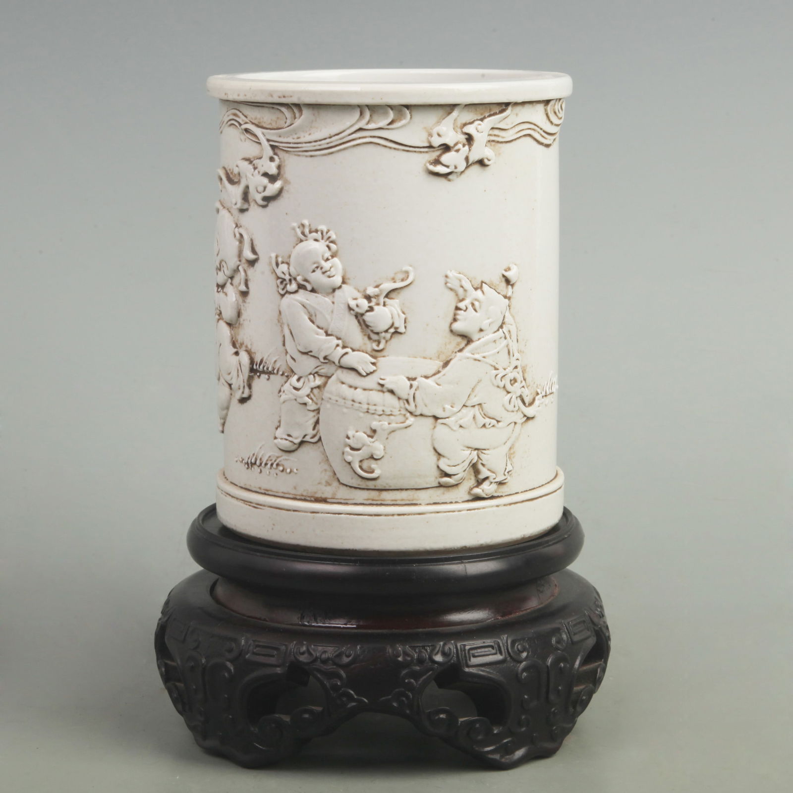 WANG BING RONG MARK "CHILD PLAYING DRUM" PORCELAIN BRUSH POT: Qing Dynasty; High: 5.5 inch; Diameter: 4.3 inch