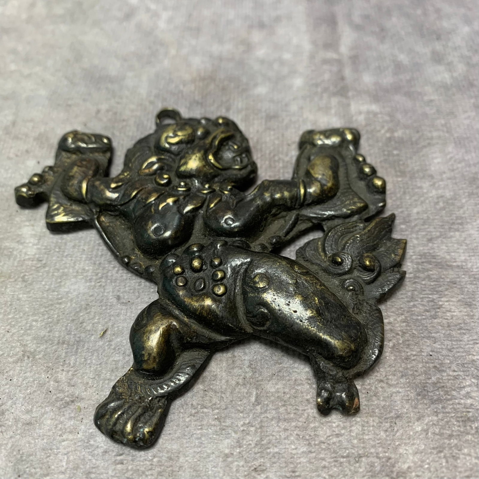 TIBETAN BUDDHIST BRONZE LION PENDANT: Qing Dynasty; Long: 3.6 inch; Width: 3.5 inch; High: 0.3 inch