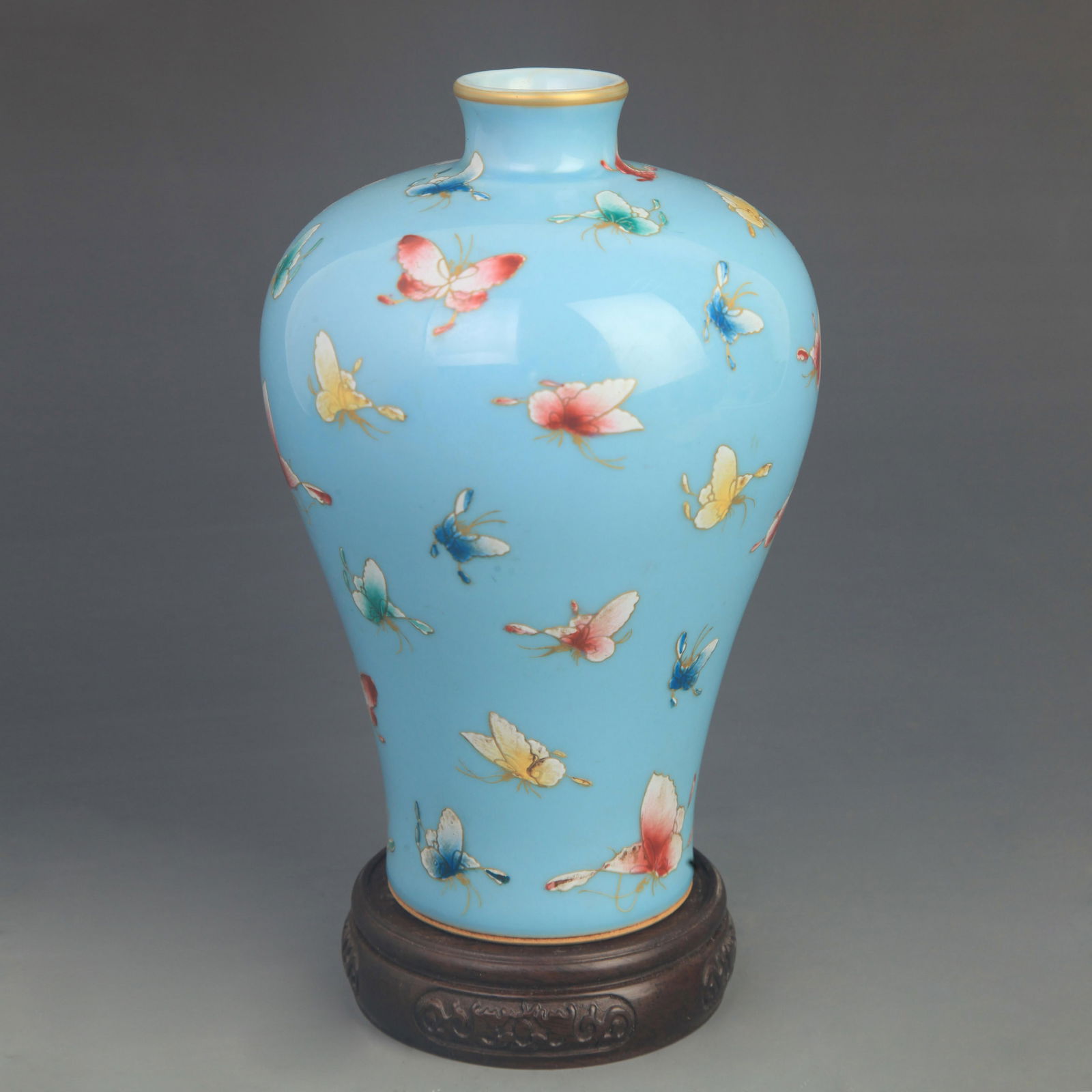 FAMILLE-ROSE BLUE-GROUND HUNDRED-BUTTERFLY PRUNUS VASE: Qing Dynasty Qian Long Period;High: 8.00 inch;Diameter: 5.00 inch