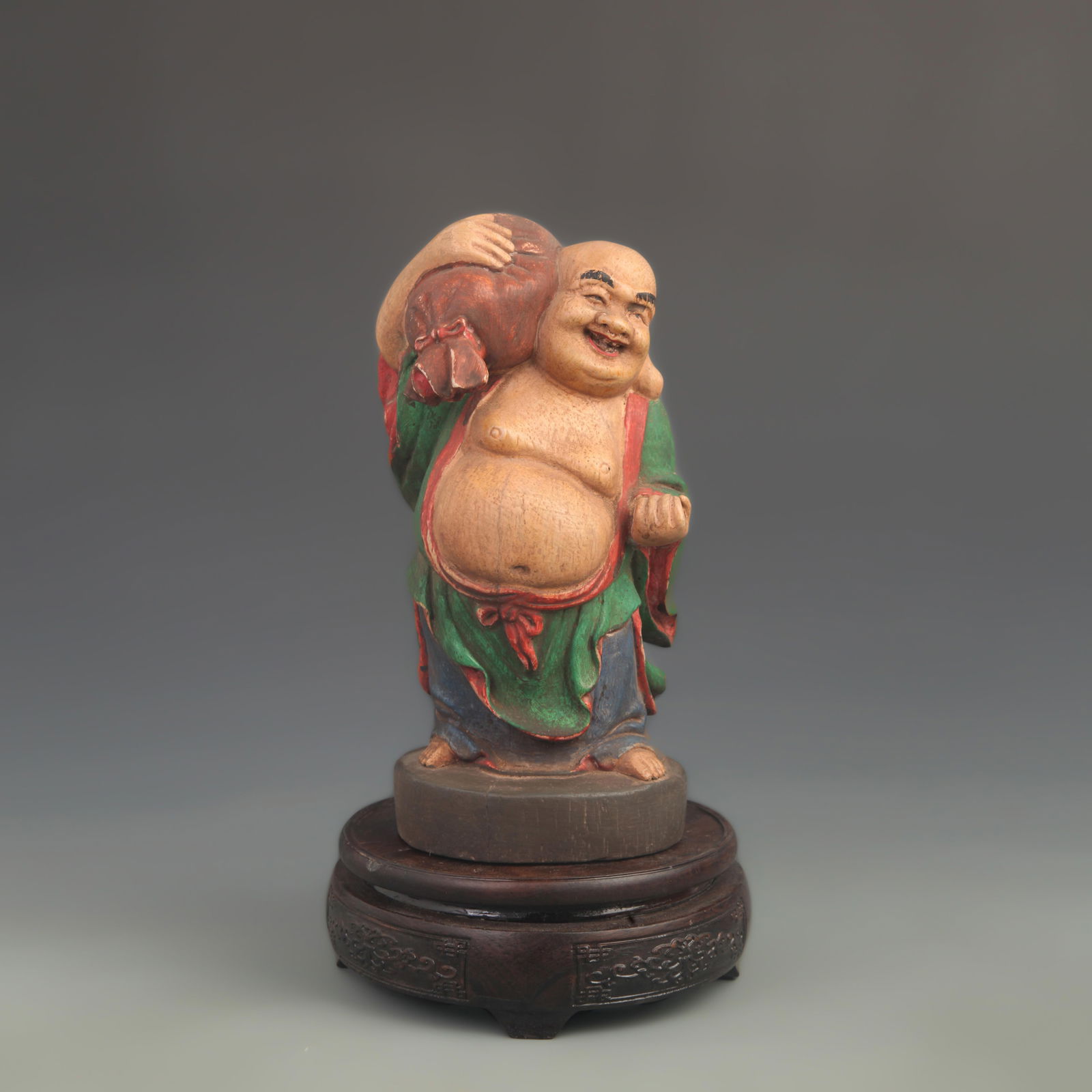 A FINE COLOR PAINTED FIGURINE OF A MONK WITH A CLOTH BAG: 20th Century; High: 8.0 inch; Width: 4.0 inch;
