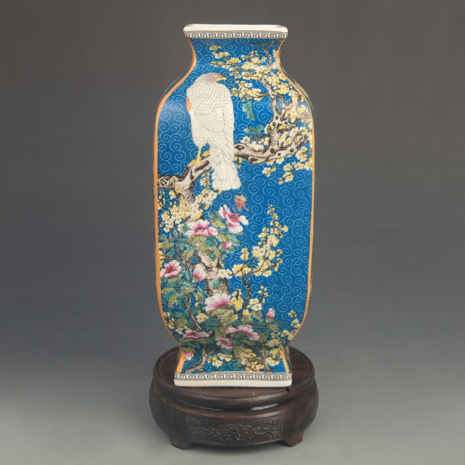 FAMILLE ROSE BLUE GROUND FLOWER AND BIRD FOUR-SIDED VASE: Qing Dynasty Qian Long Period; High: 11.0 inch; Diameter: 4.80 inch