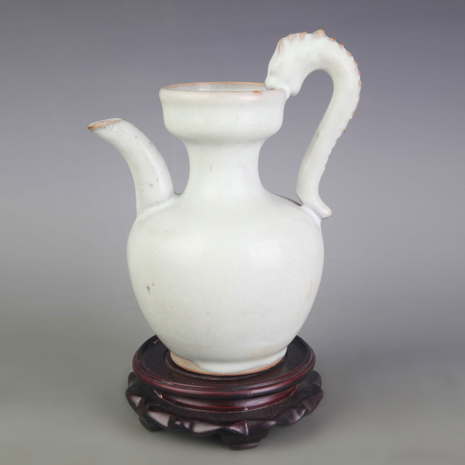 A FINE GREEN-GLAZED PORCELAIN EWER: Five Dynasty Style; Width: 7.0 inch; High: 8.3 inch