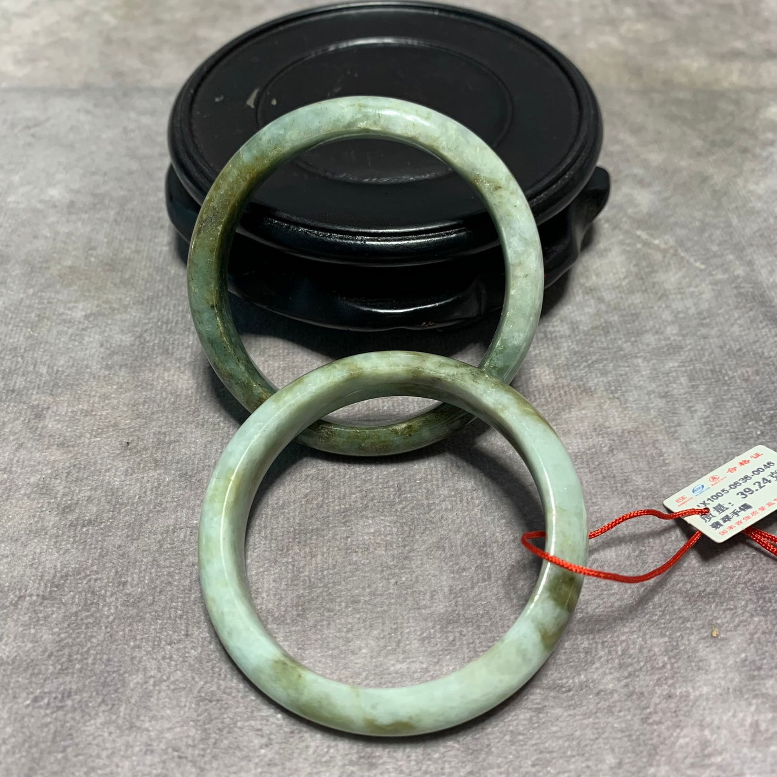 PAIR OF JADEITE BRACELETS: Modern; High: 0.5 inch; Diameter: 2.2 inch;