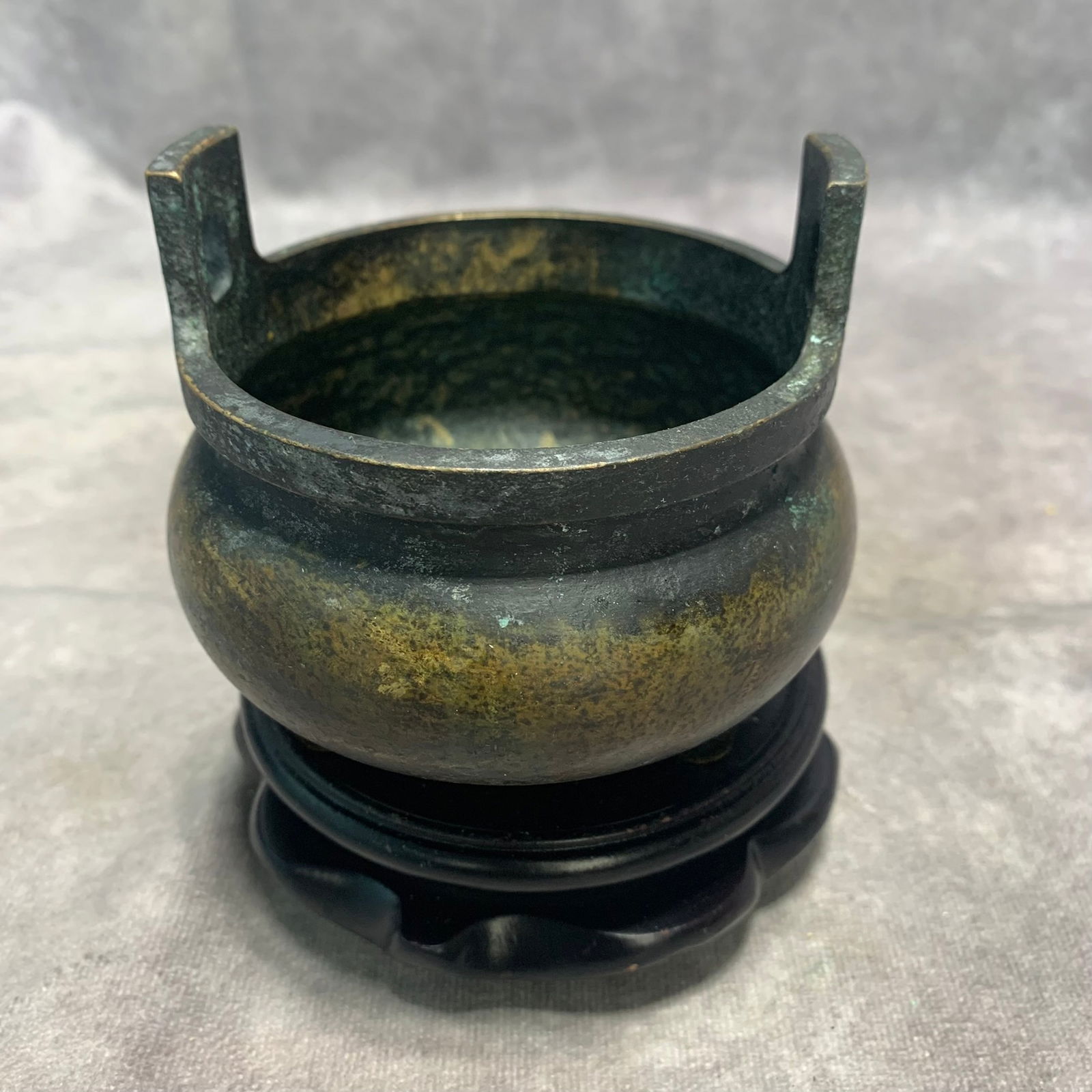 QIANLONG PERIOD MARKED BRONZE TRIPOD INCENSE BURNER WITH UPRIGHT HANDLES: Qing Dynasty; H; 3.3 inch; D; 4 inch