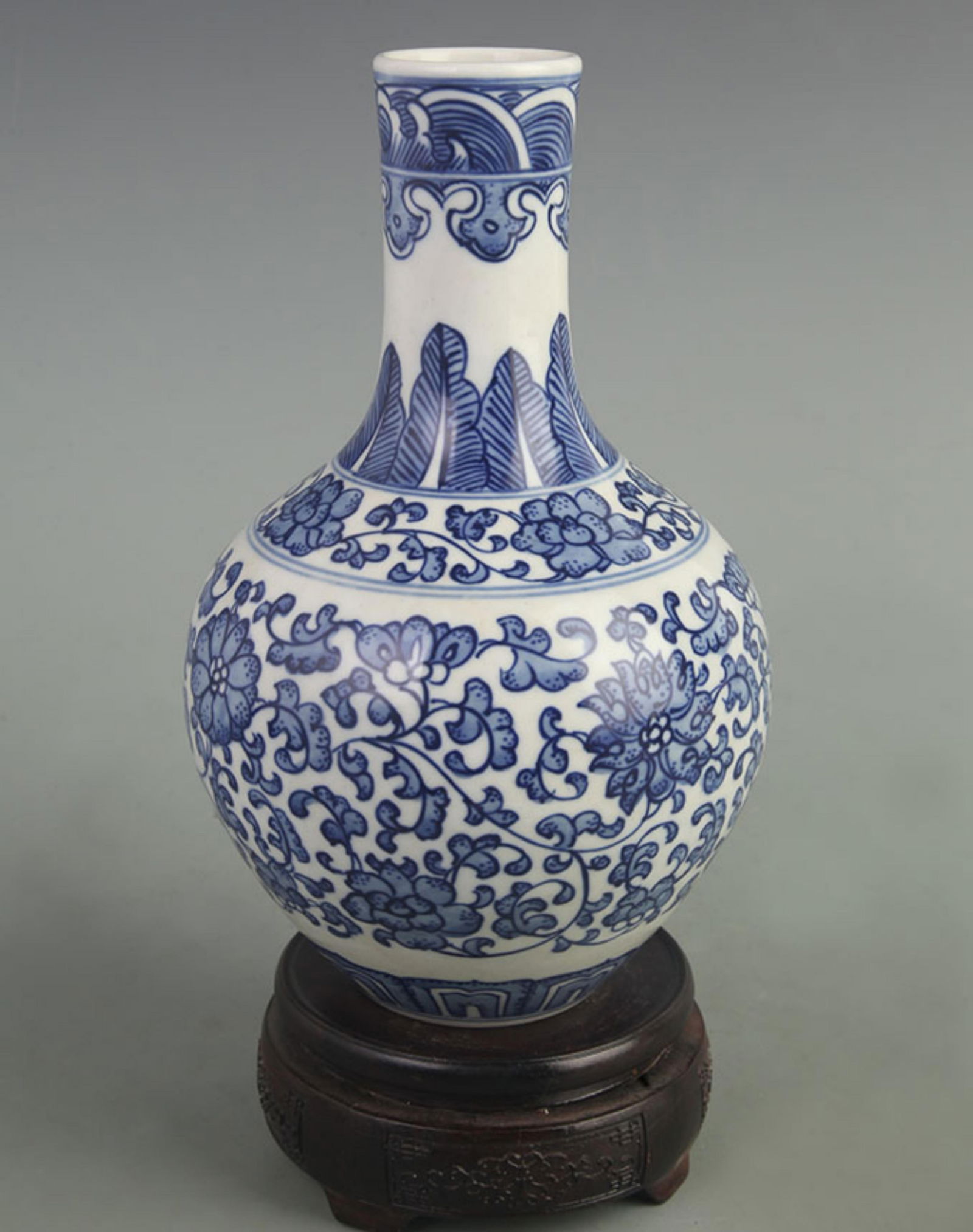 BLUE AND WHITE PORCELAIN VASE WITH TWISTED BRANCHES AND LOTUS MOTIF: Qing Dynasty Qian Long Period; High: 8.50 inch; Width: 5.50 inch;