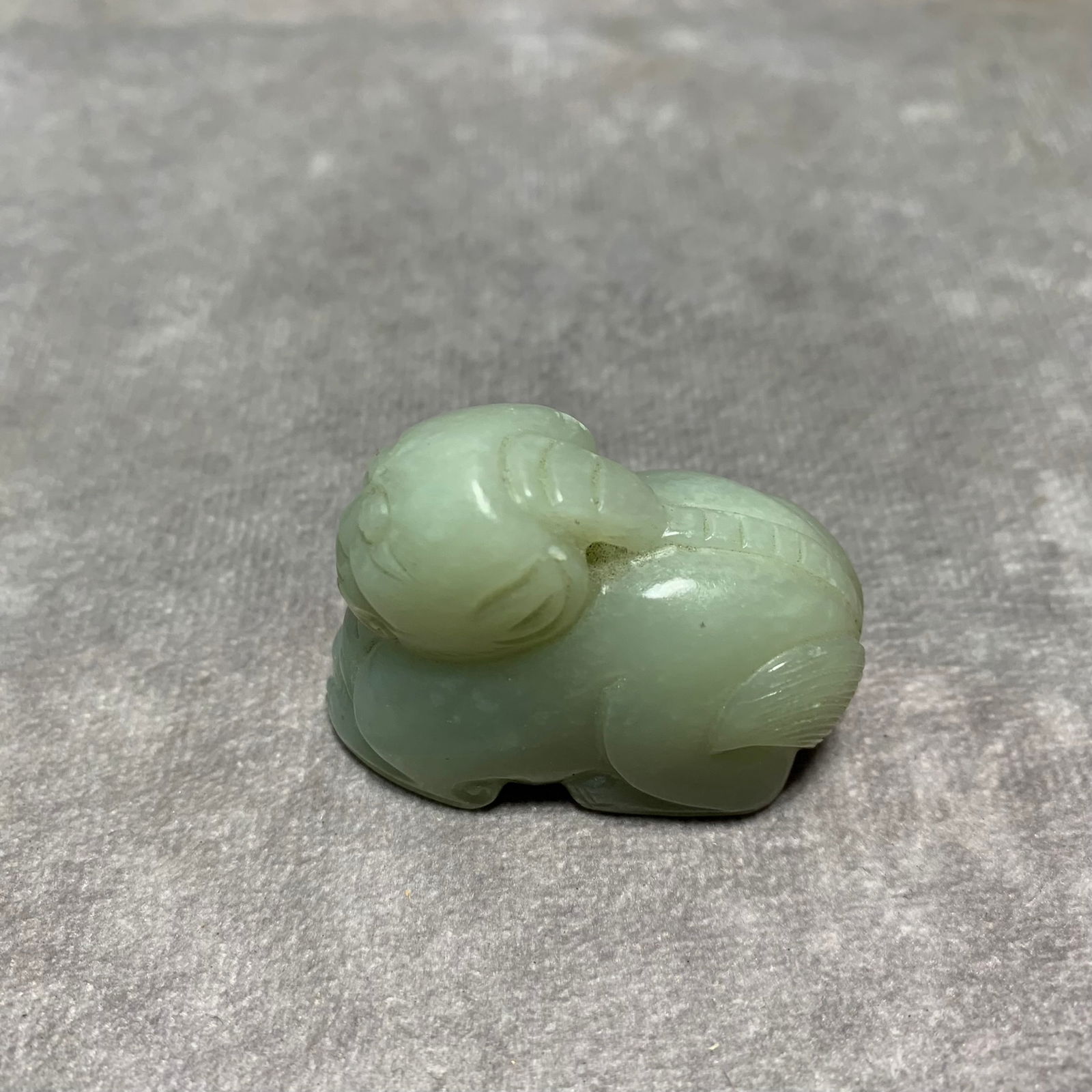 HETIAN GREENISH-WHITE JADE PENDANT WITH AUSPICIOUS BEAST DESIGN: Qing Dynasty; Long: 1.7 inch; Width: 0.9 inch; High: 0.2 inch;