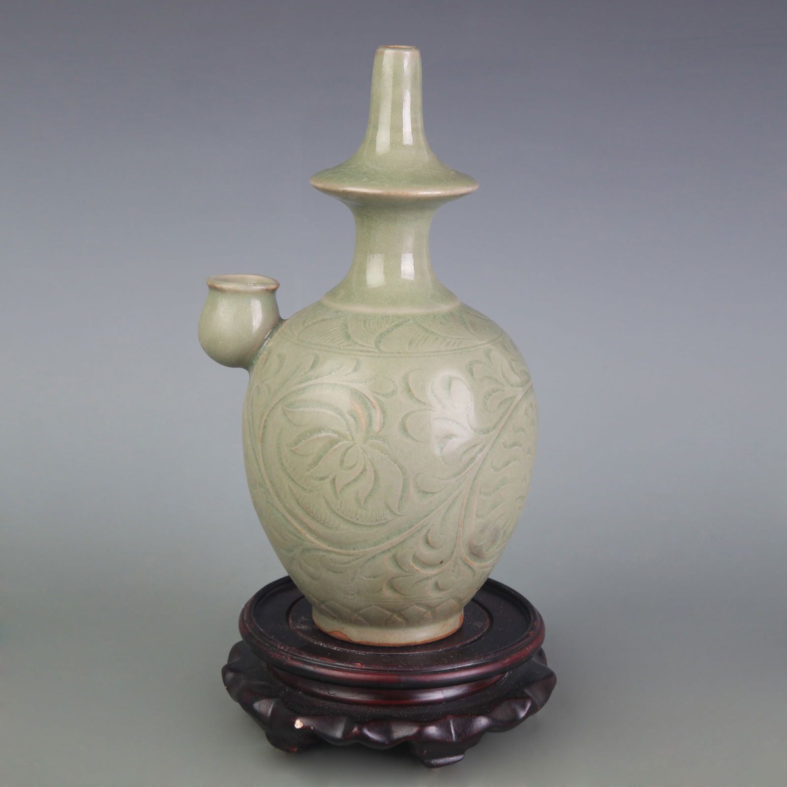 A FINE CELADON COLOR GLAZED FLOWER CARVING TEAPOT: Song Dynasty Style; Width: 5.1 inch; High: 8.9 inch