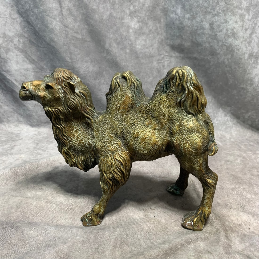 CONTEMPORARY BRONZE CAMEL STATUE ORNAMENT: Modern; Long: 10 inch; Width: 4.5 inch; High: 8 inch;
