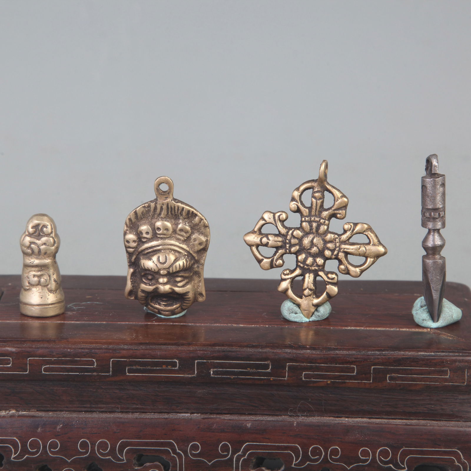 TIBETAN BUDDHIST STATUES AND RITUAL OBJECTS (4 PIECES): Qing Dynasty; Long: 2.2 inch to 1.3 inch
