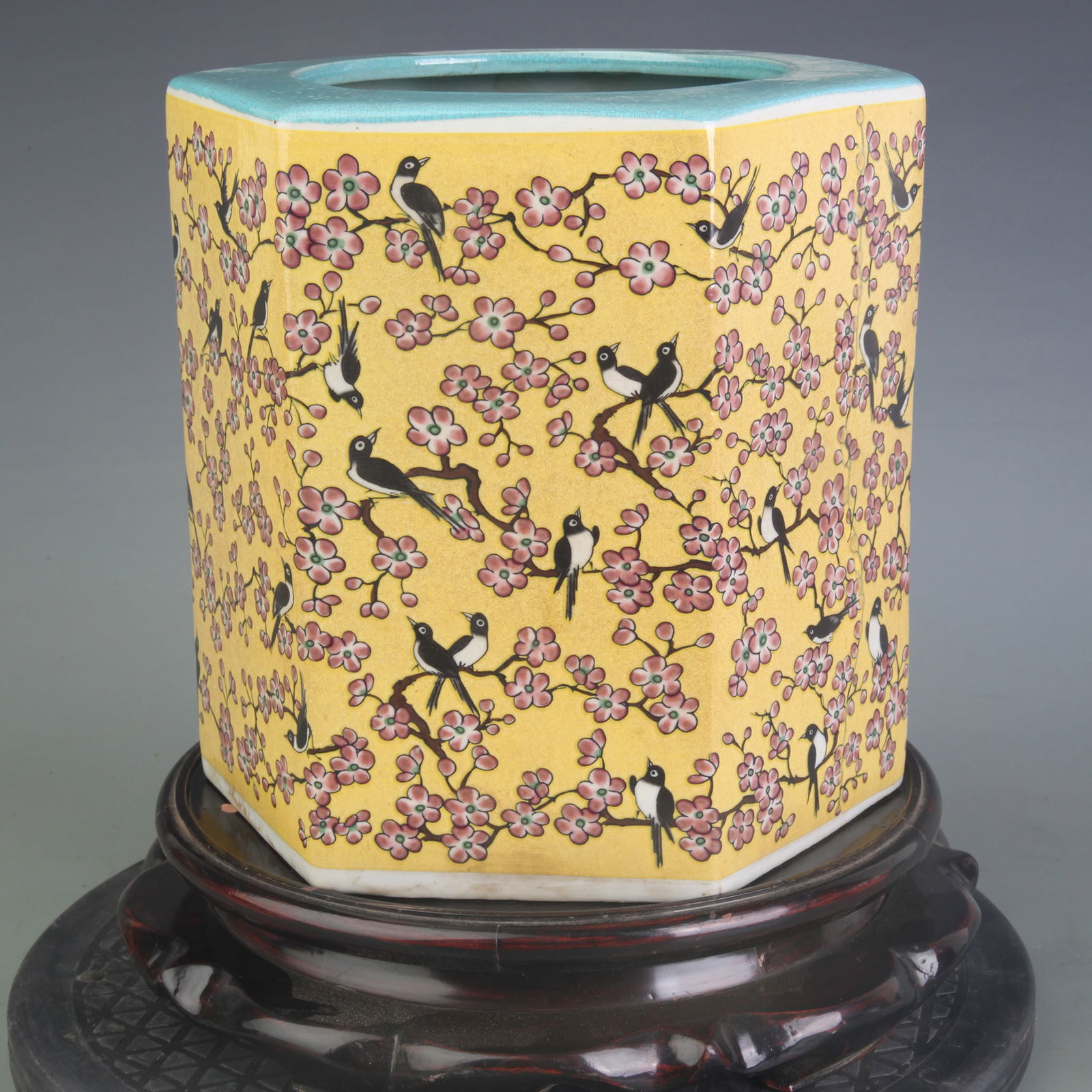 FAMILLE ROSE HEXAGONAL BRUSH POT WITH FLOWER AND BIRD PATTERNS ON YELLOW GROUND: Qing Dynasty; Width: 8.1inch; High: 8.1inch