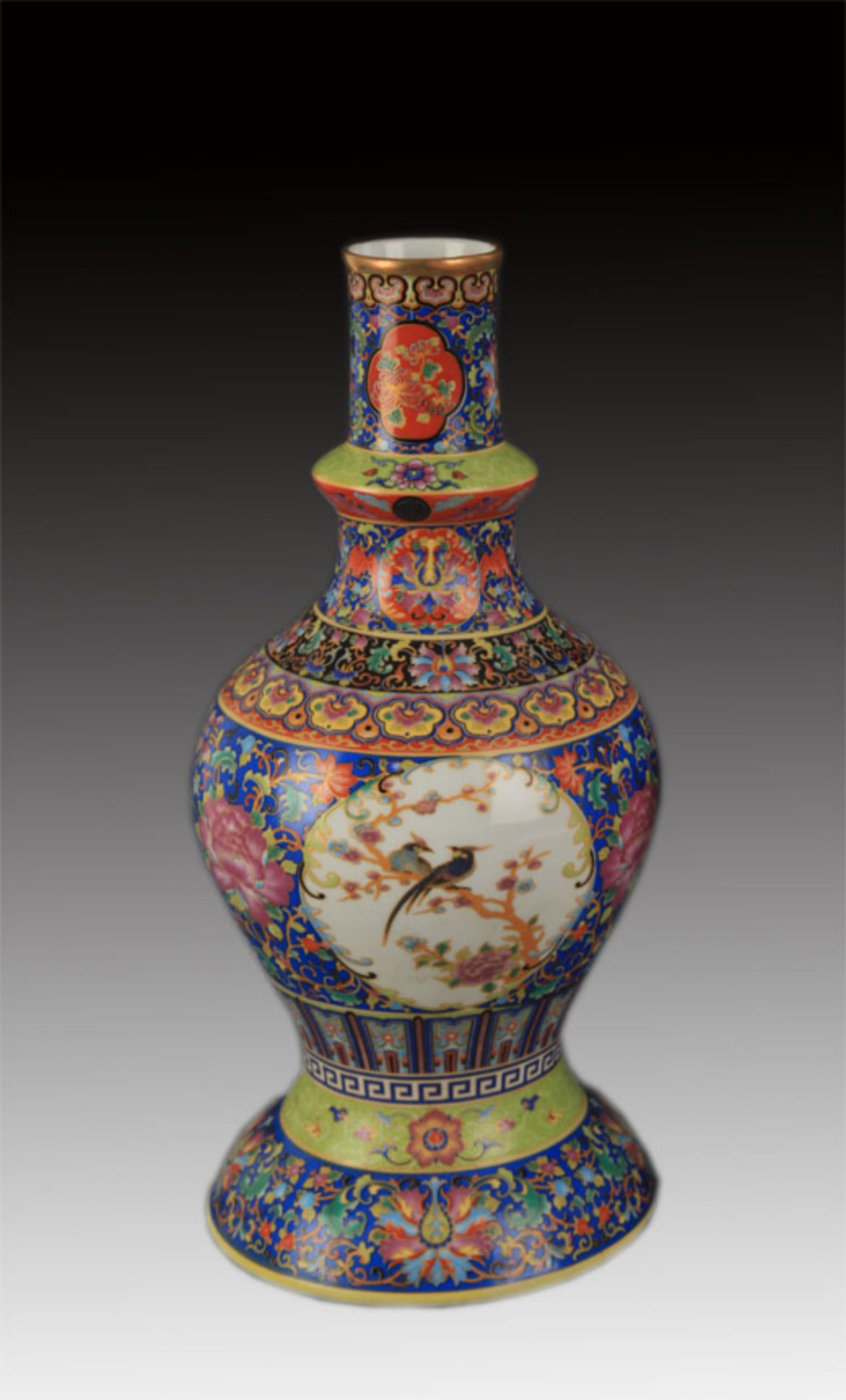 A FINE ENAMEL COLOR FLOWER AND BIRD PORCELAIN BOTTLE: Qing Dynasty Yong Zheng Period; High: 11.25 inch Diameter: 1.5 inch