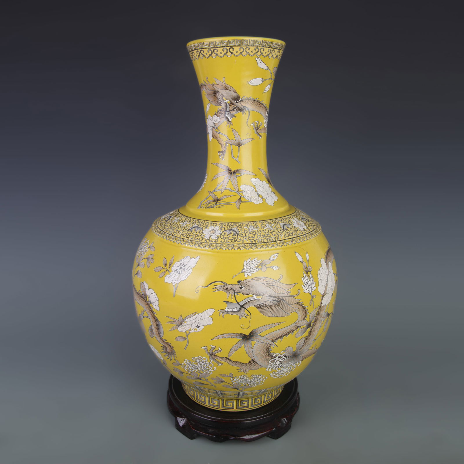 FAMILLE ROSE YELLOW GROUND FLORAL DRAGON GLOBE VASE: Qing Dynasty; Diameter: 10.3 inch; High: 16.6 inch