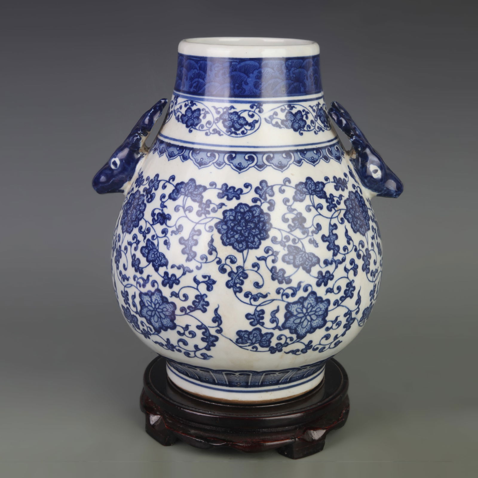 BLUE AND WHITE FLORAL VASE WITH DEER HEAD HANDLES: Qing Dynasty Qian Long Period; Diameter: 9.5 inch; High: 11.0 inch