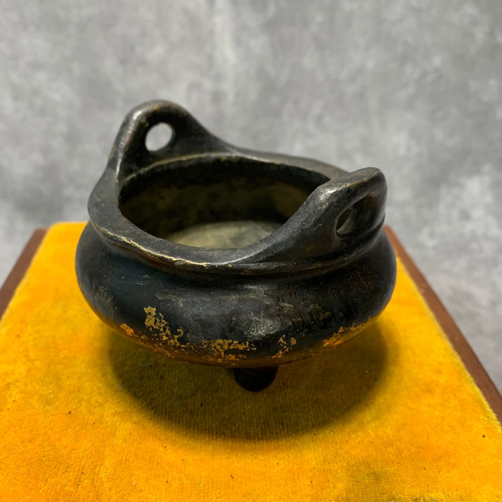 XUANDE ERA FOUR-LEGGED CENSER WITH DRAGON PATTERNS: Ming Dynasty; High: 2.5 inch; Diameter: 3.6 inch;