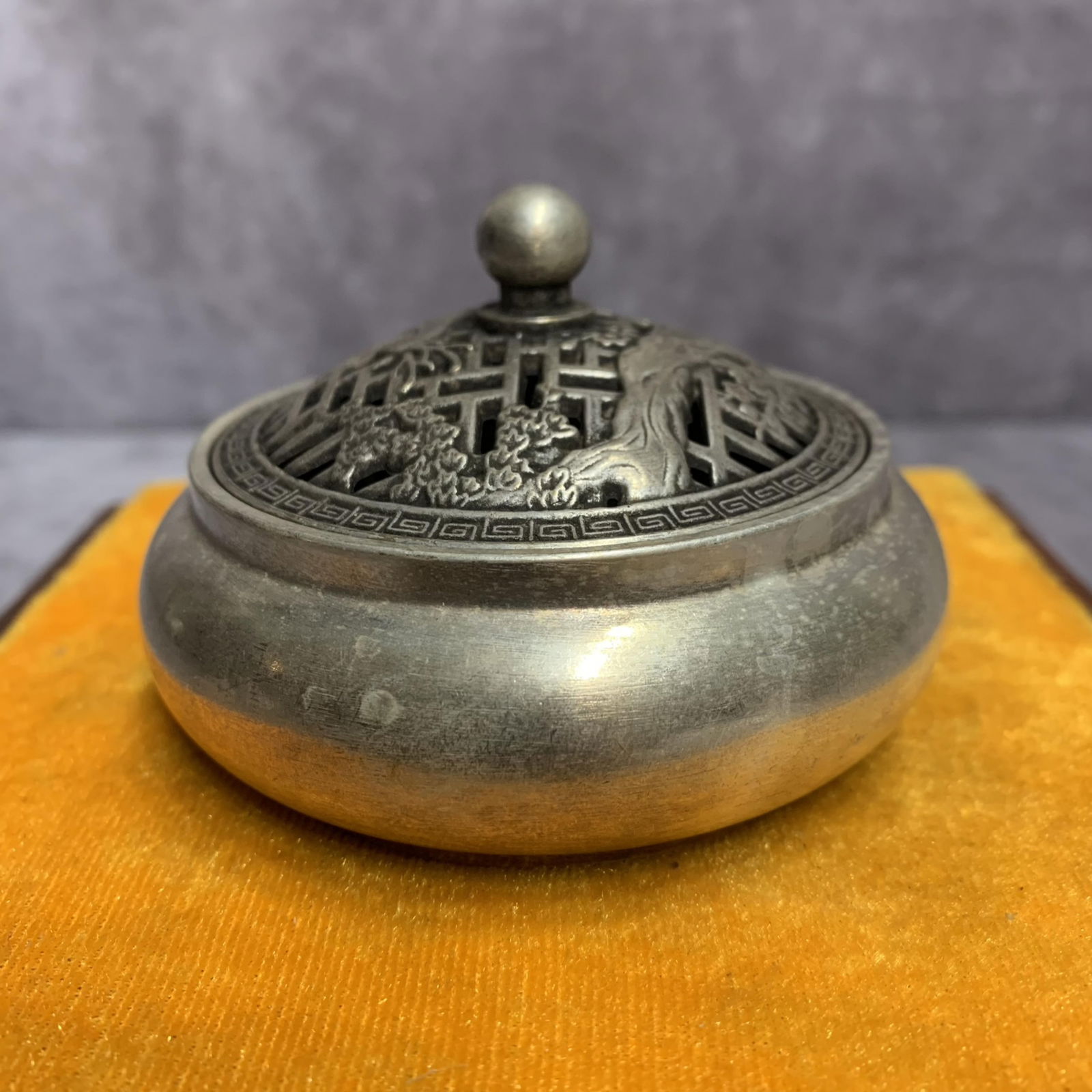 A FINE WHITE BRONZE ROUND SHAPED INCENSE BURNER: Modern; High: 2.1 inch; Diameter: 3.4 inch