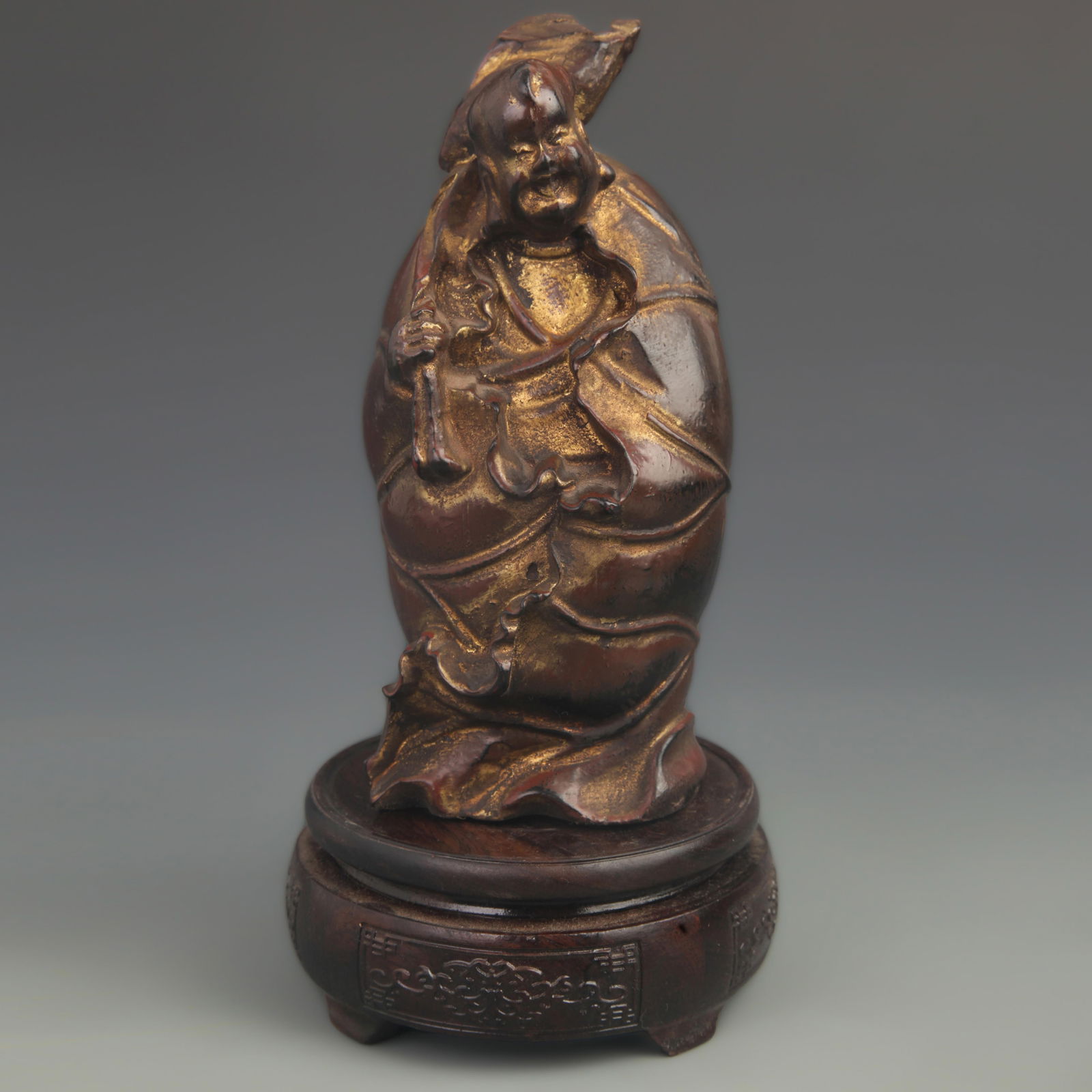 LACQUERED WOOD GILDED LOTUS BOY STATUE: 20th Century; High: 7.75 inch; Width:3.50 inch;
