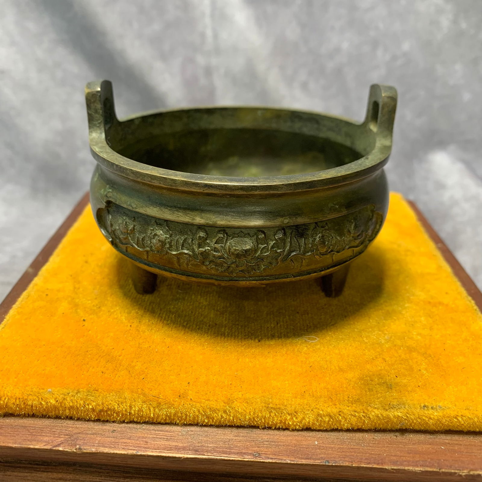 XUANDE MARK BRONZE THREE-LEGGED CENSER WITH VERTICAL HANDLES: Ming Dynasty Style; High: 2.5 inch; Diameter: 3.8 inch