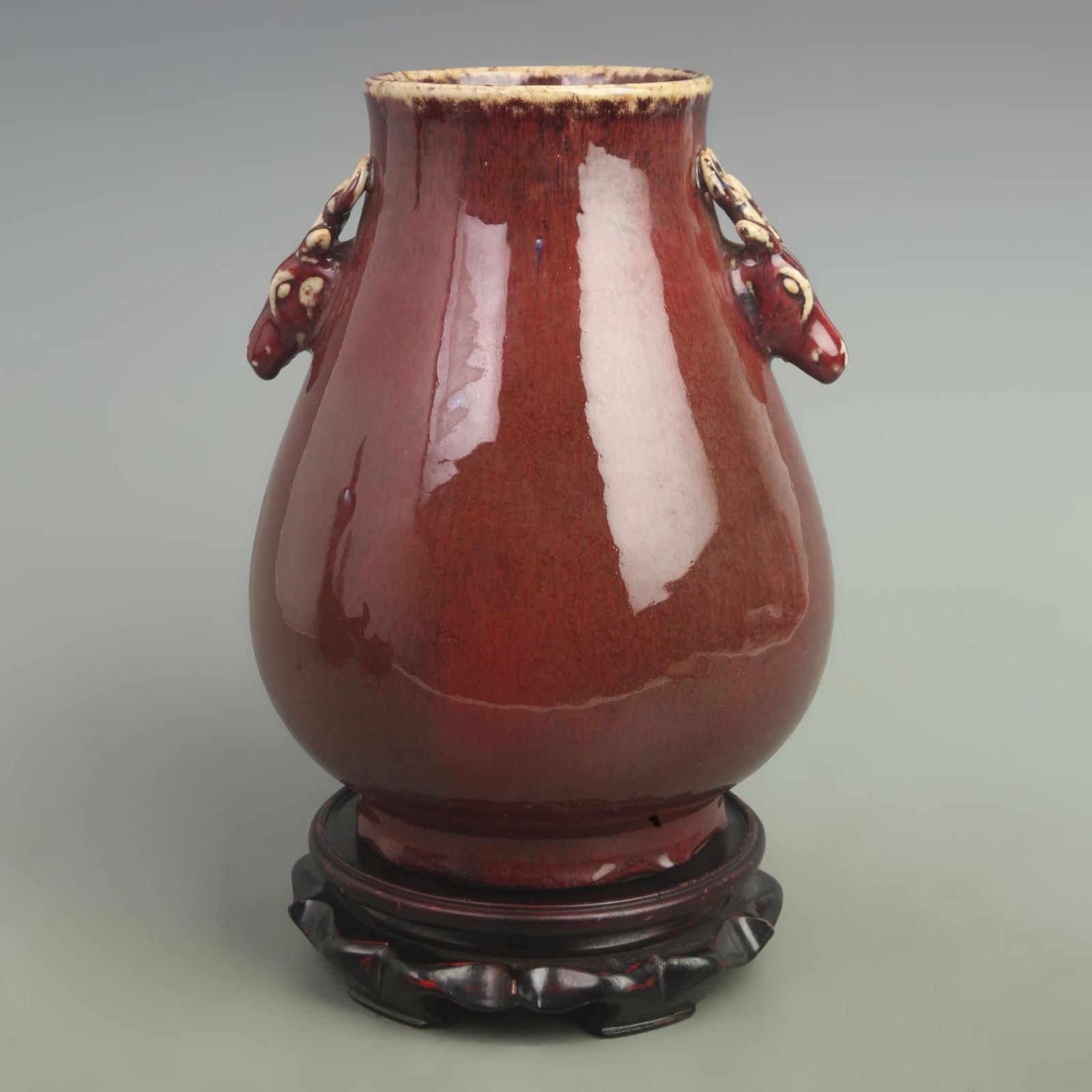 A FINE RED COLOR GLAZED DEER HEAN STYLE PORCELAIN VASE: Qing Dynasty; High: 10.6 inch; Width: 9.0 inch