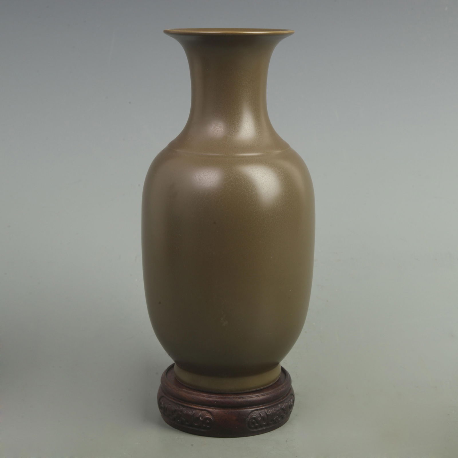 A TEA COLOR GLAZED DARK GREEN PORCELAIN VASE: Qing Dynasty Yong Zheng Period; High: 10.2 inch Width: 5.5 inch