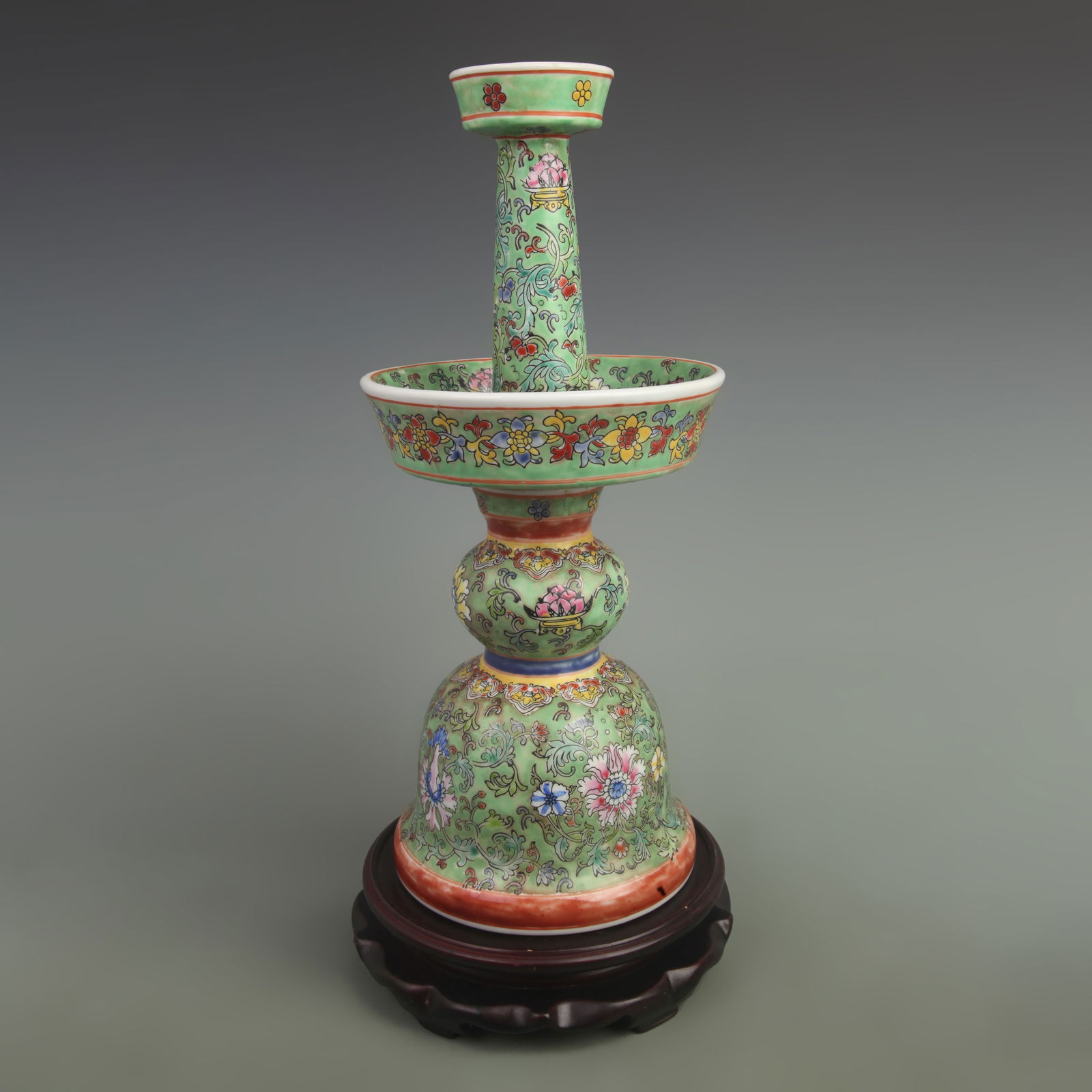 A FINE GREEN GROUND PORCELAIN CANDLESTICK WITH FLORAL DESIGN: Qing Dynasty Qian Long Period;;High: 15.5 inch; Width: 6.5 inch;