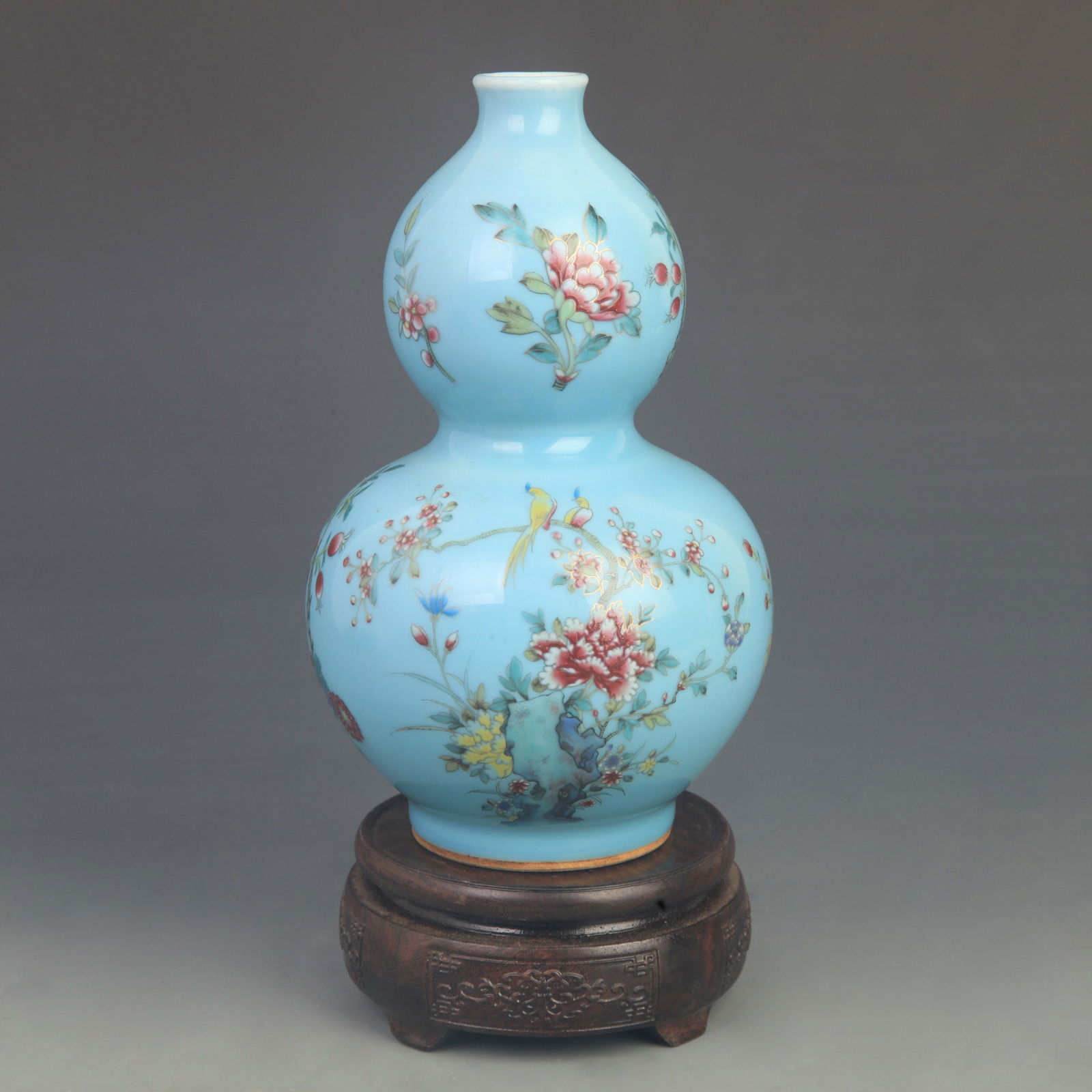 FAMILLE ROSE BLUE GROUND FLORAL GOURD VASE: Qing Dynasty Qian Long Period; High: 8.50 inch; Diameter: 4.80 inch;