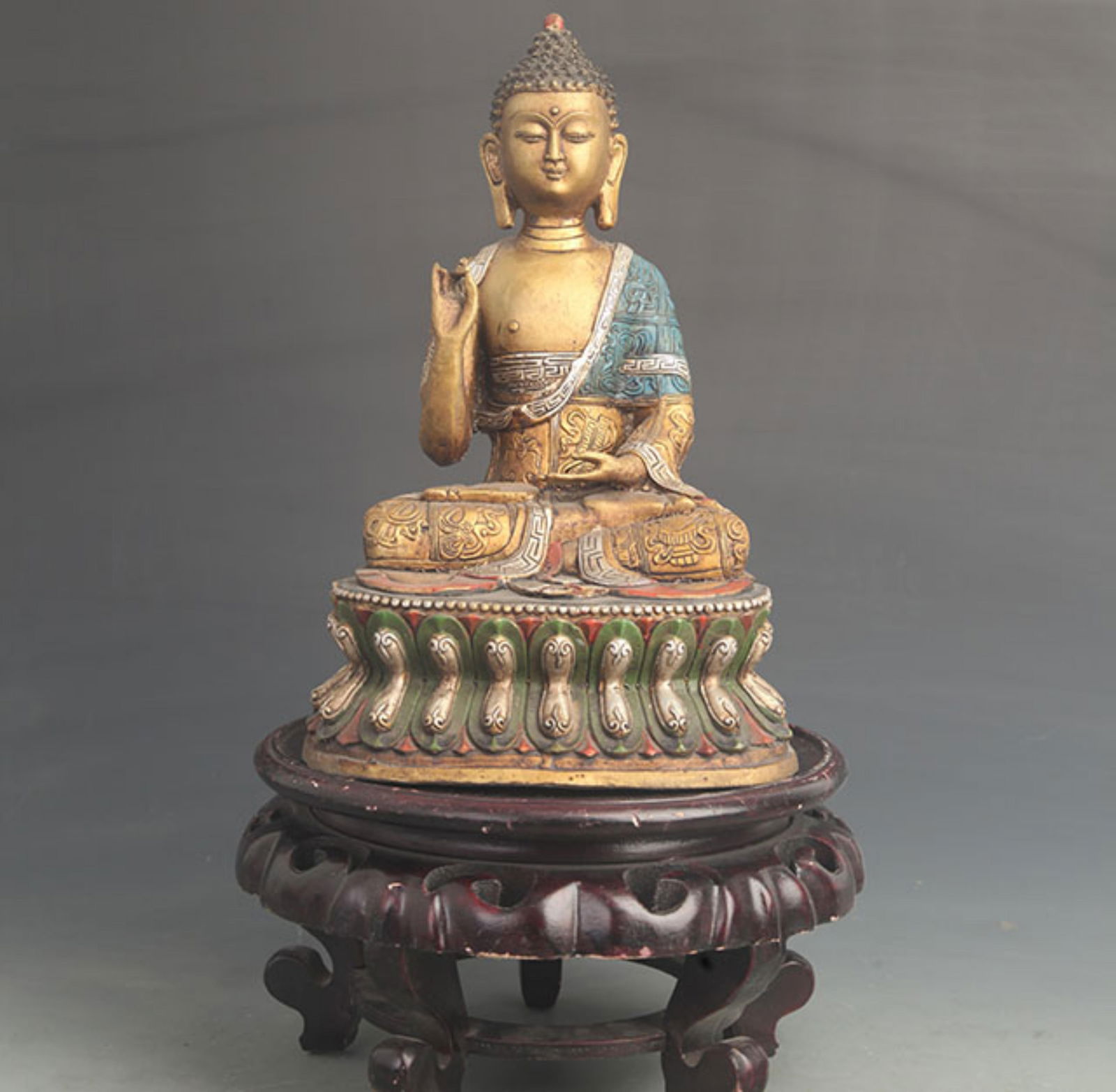 GILT BRONZE STATUE OF SHAKYAMUNI BUDDHA WITH COLORFUL PAINTED DETAILS: 19th Century; High: 11.25 inch; Width: 6.50 inch;